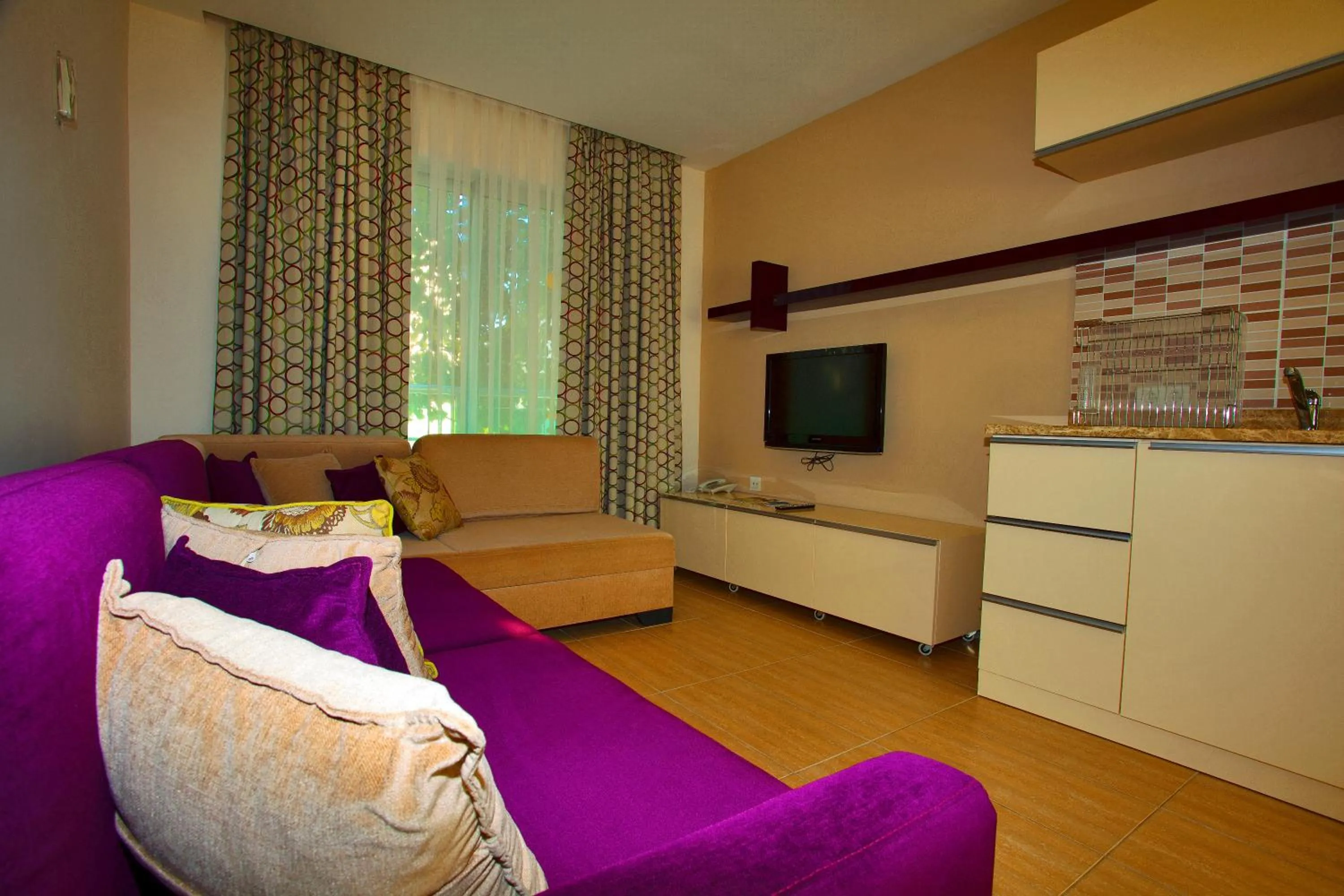 Living room, Bed in Green Garden Resort & Spa Hotel