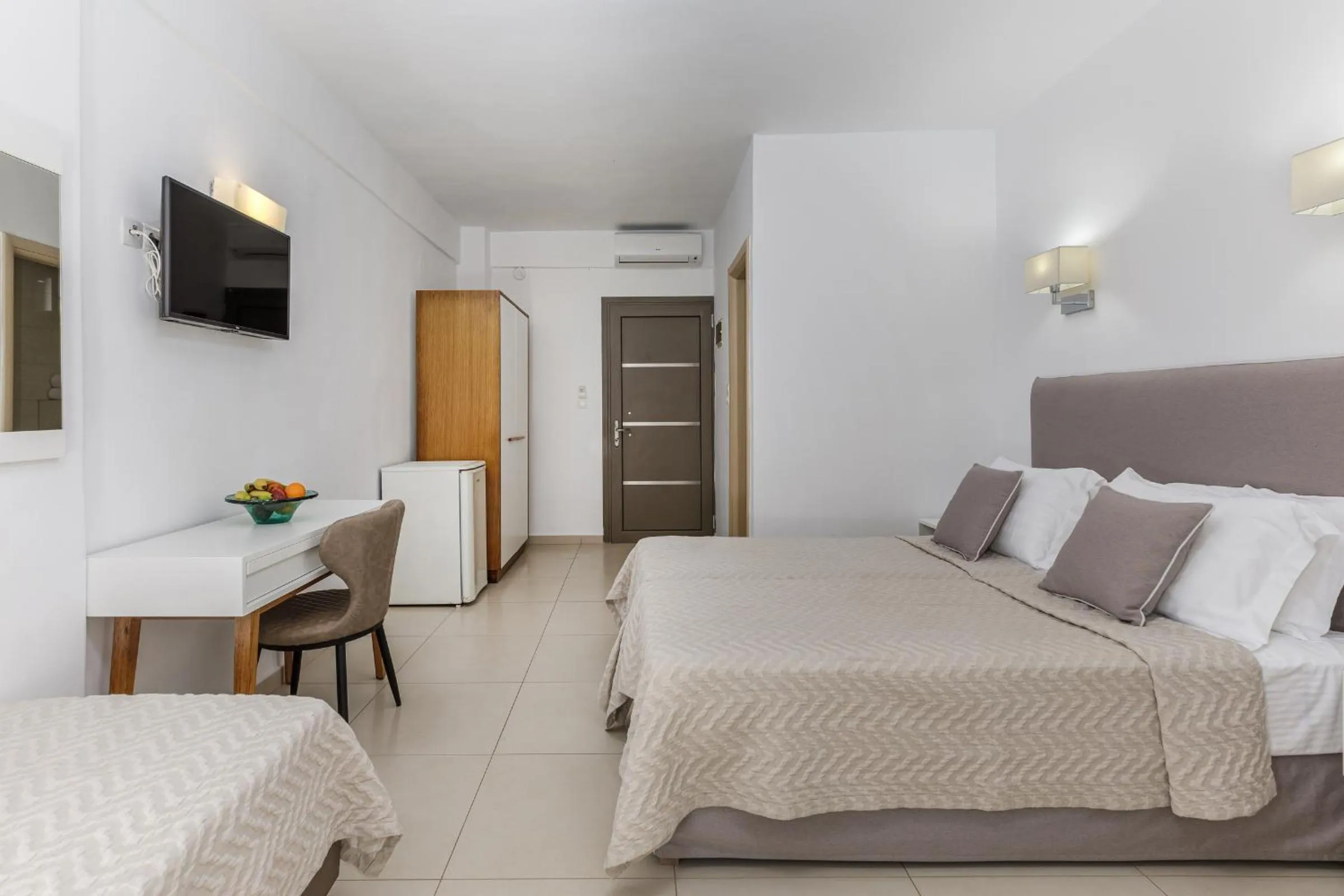 Communal lounge/ TV room, Bed in Stavros Beach Hotel