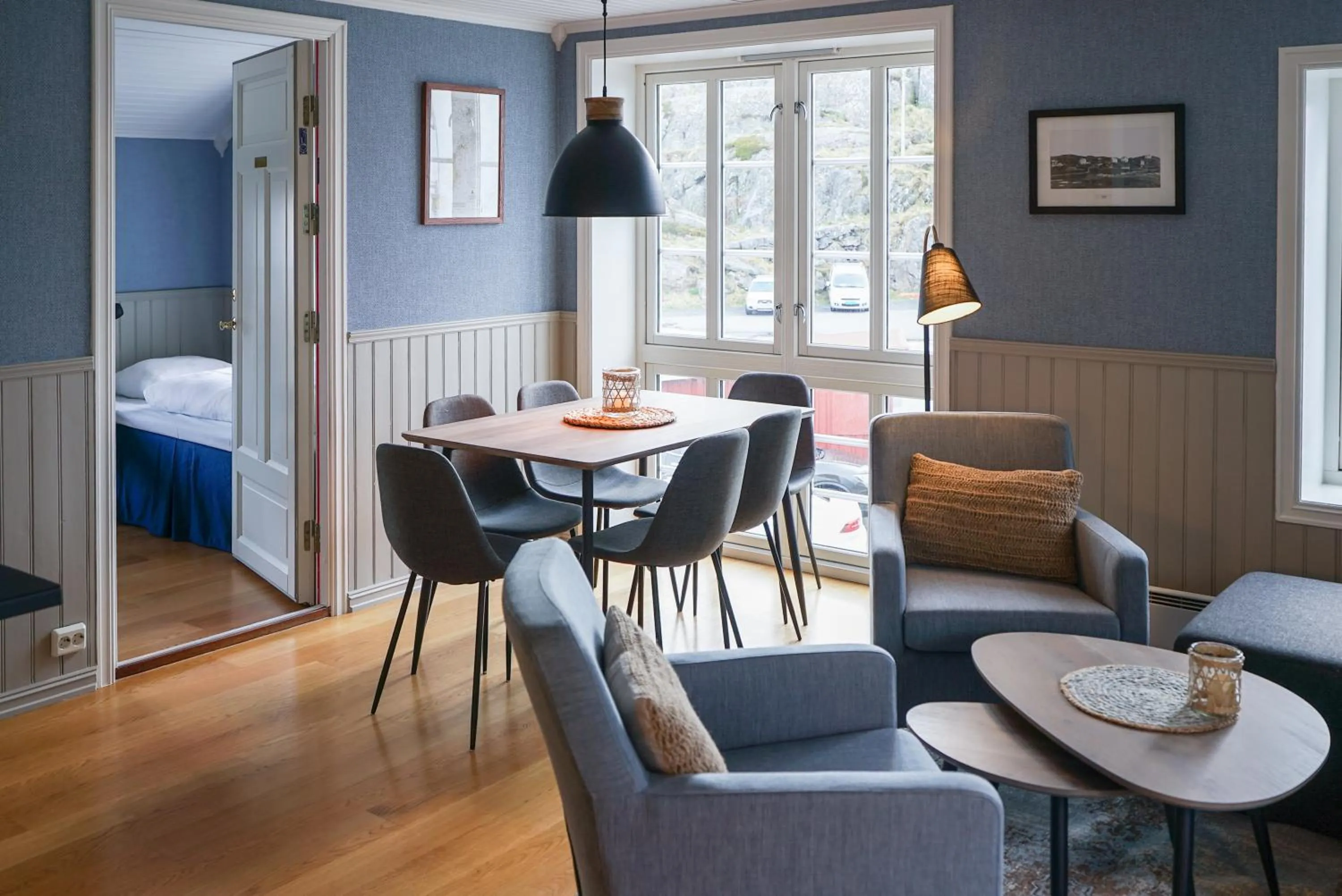 Seating area, Bed in Ona Havstuer - by Classic Norway Hotels