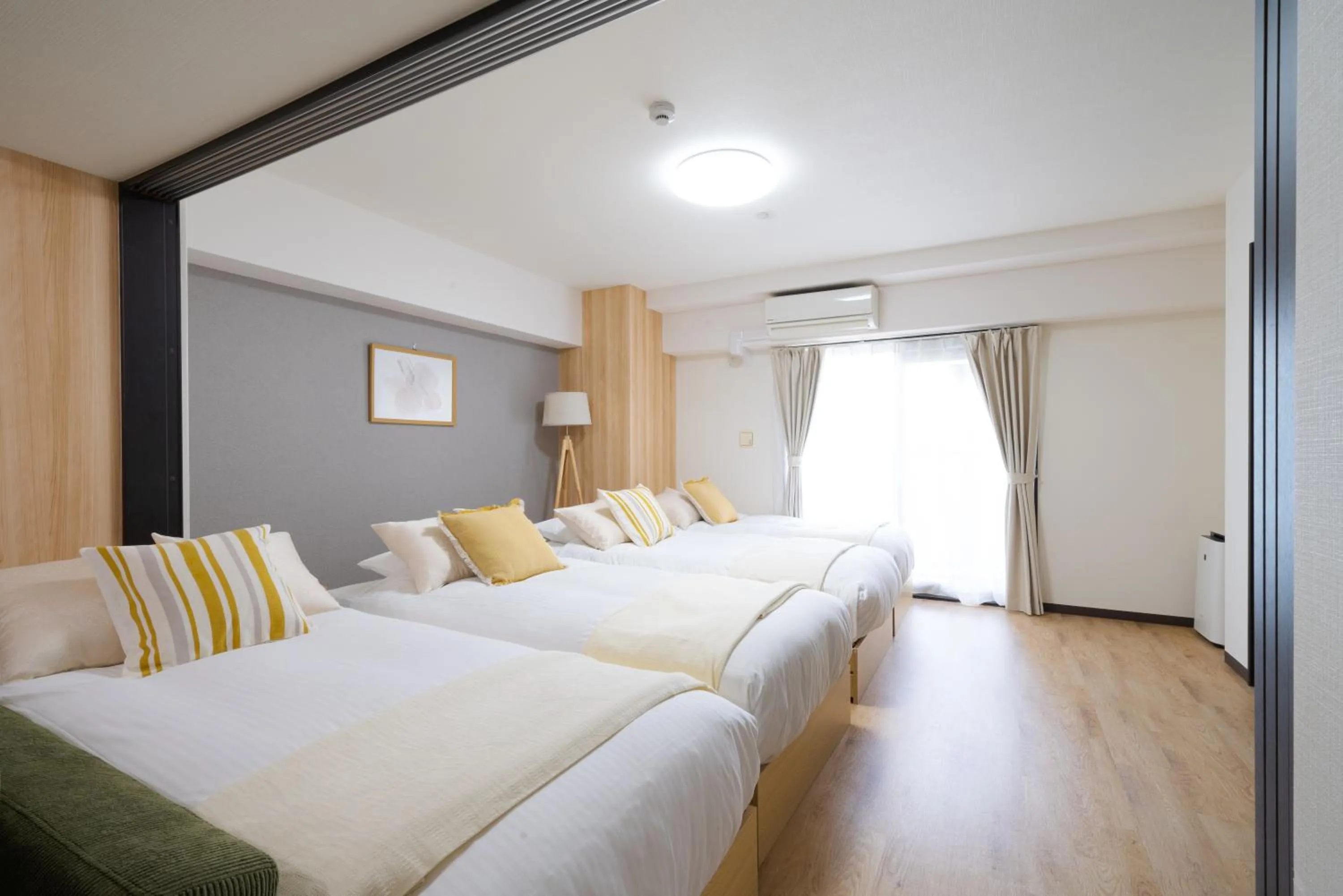 Bed in TAKUTO STAY SAKAISUJI-HOMMACHI