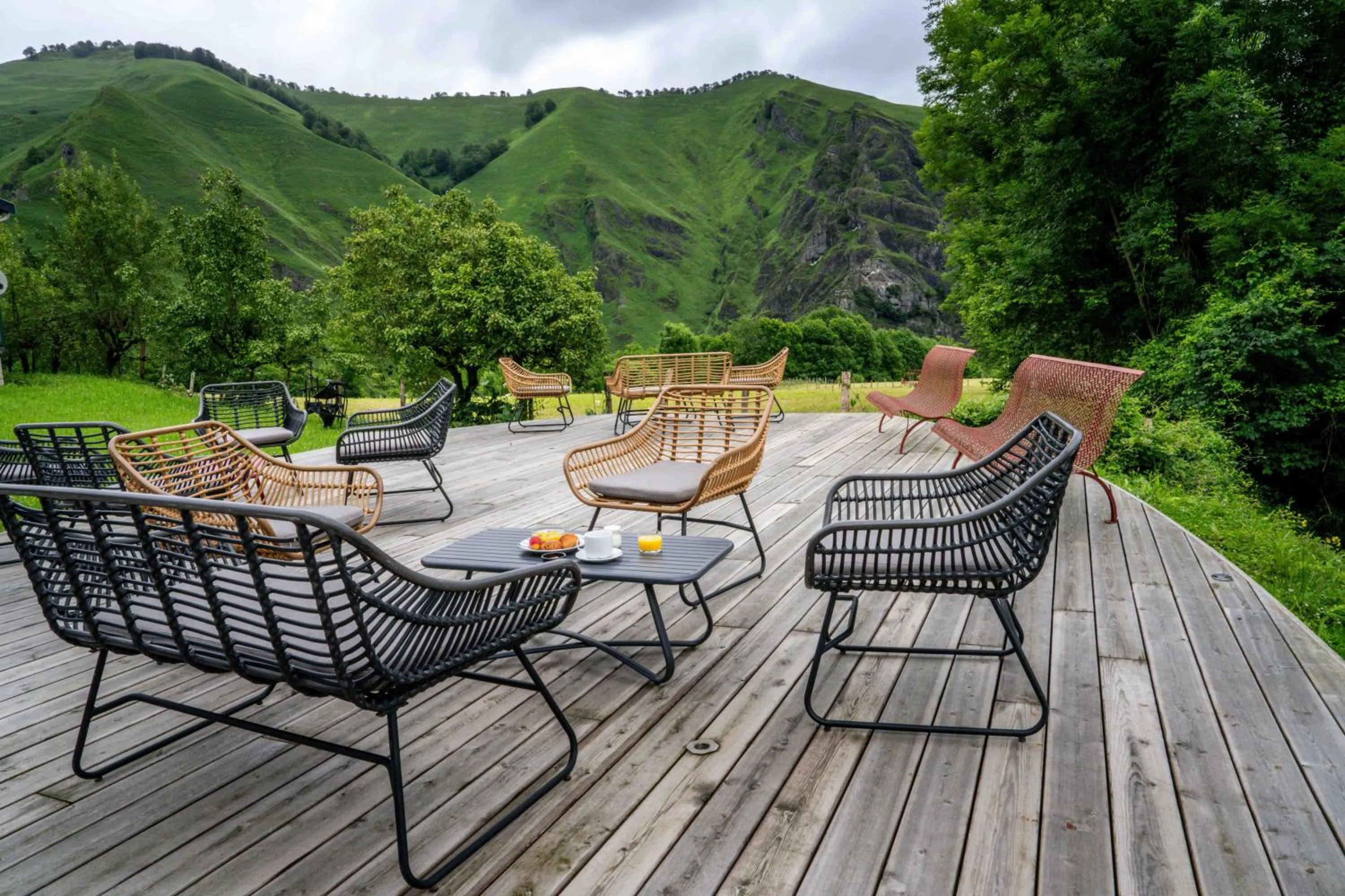 Garden view in Logis Hôtel Etchemaïté