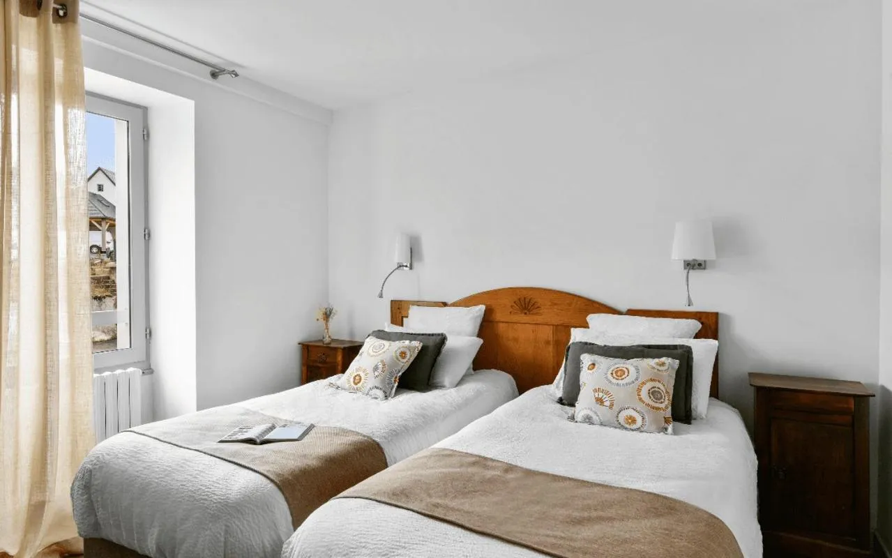 Bed in Logis Hôtel Etchemaïté