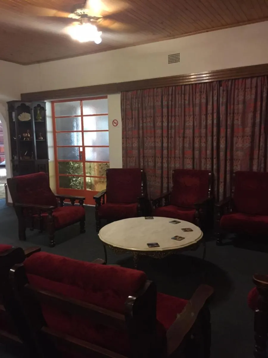 Communal lounge/ TV room in La Rive Waterberg Accommodation