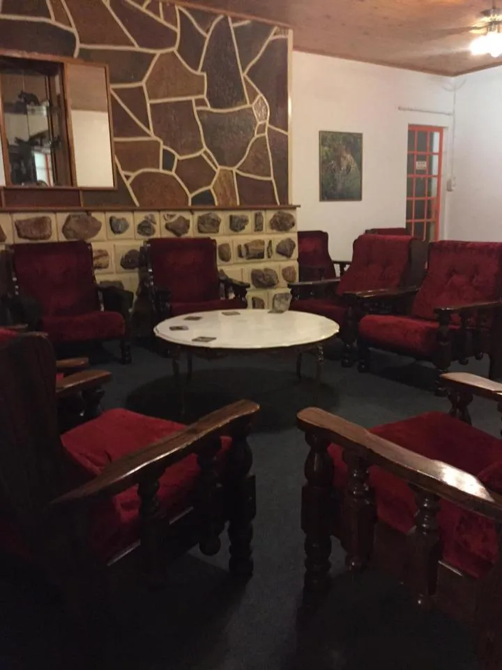 Communal lounge/ TV room in La Rive Waterberg Accommodation