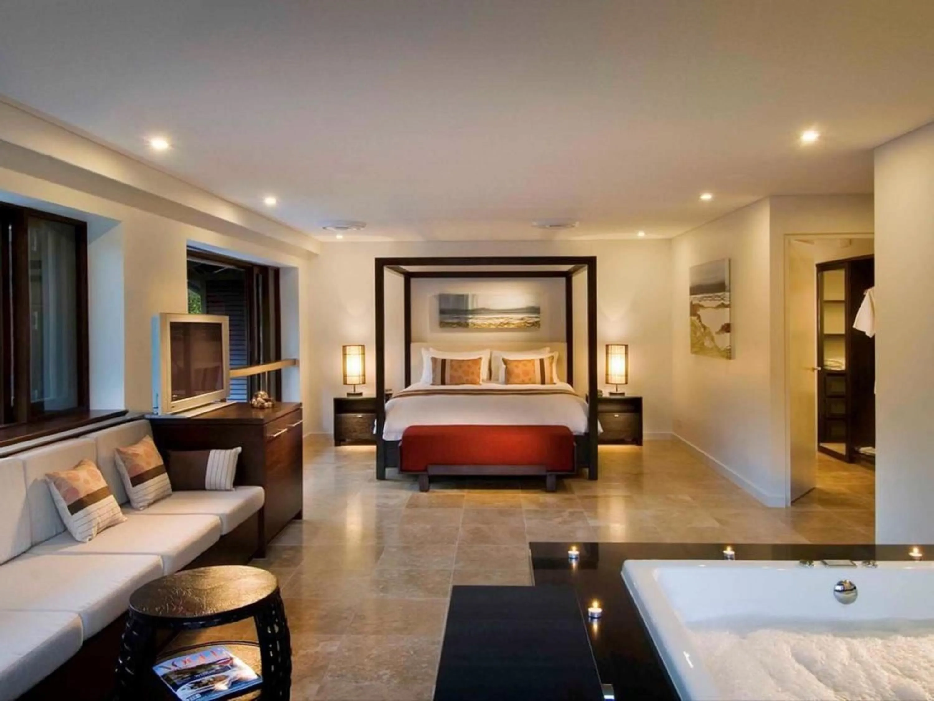 Seating area, Bed in Luxury Apartments at Temple Resort and Spa Port Douglas