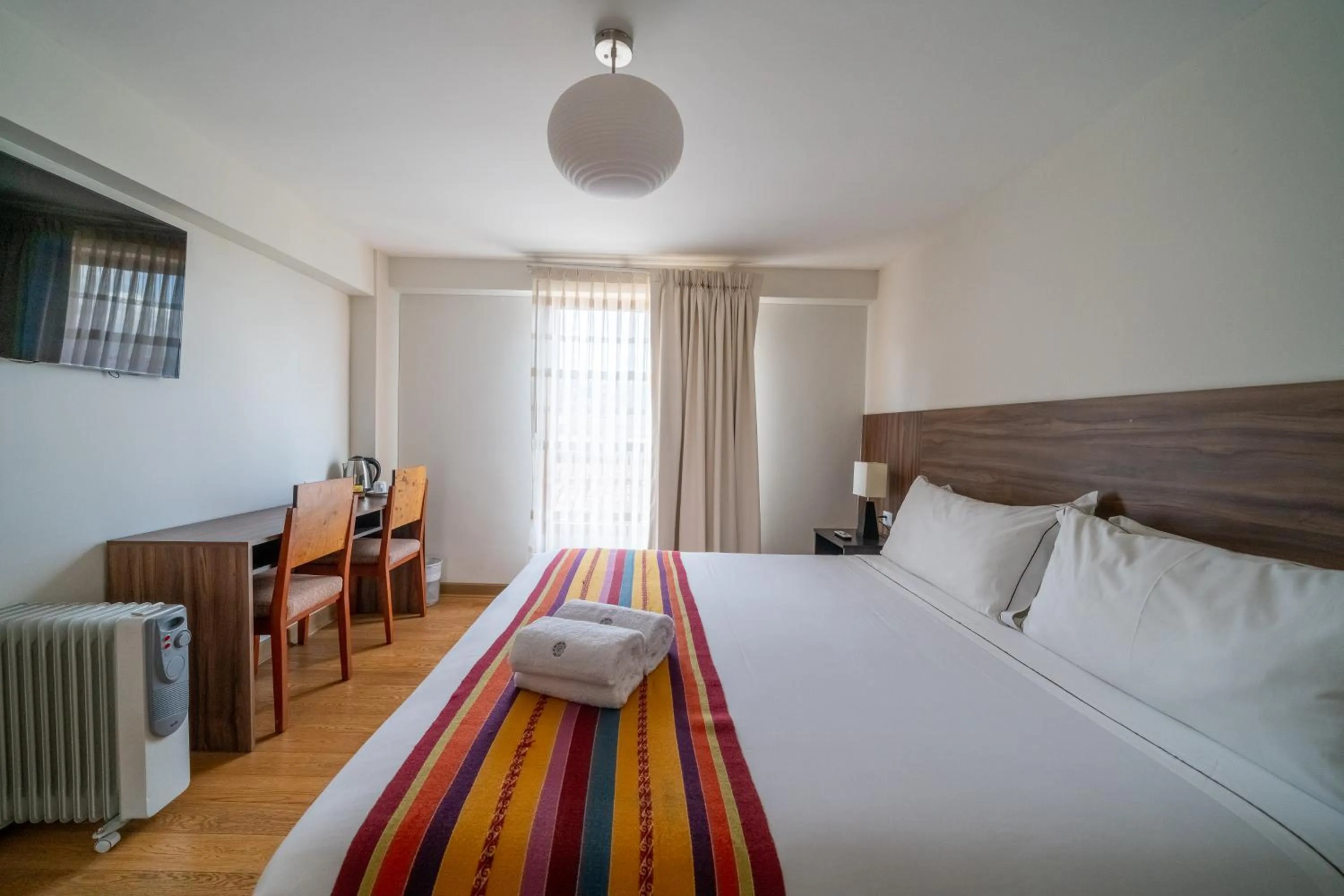 Photo of the whole room, Bed in Taypikala Hotel Cusco