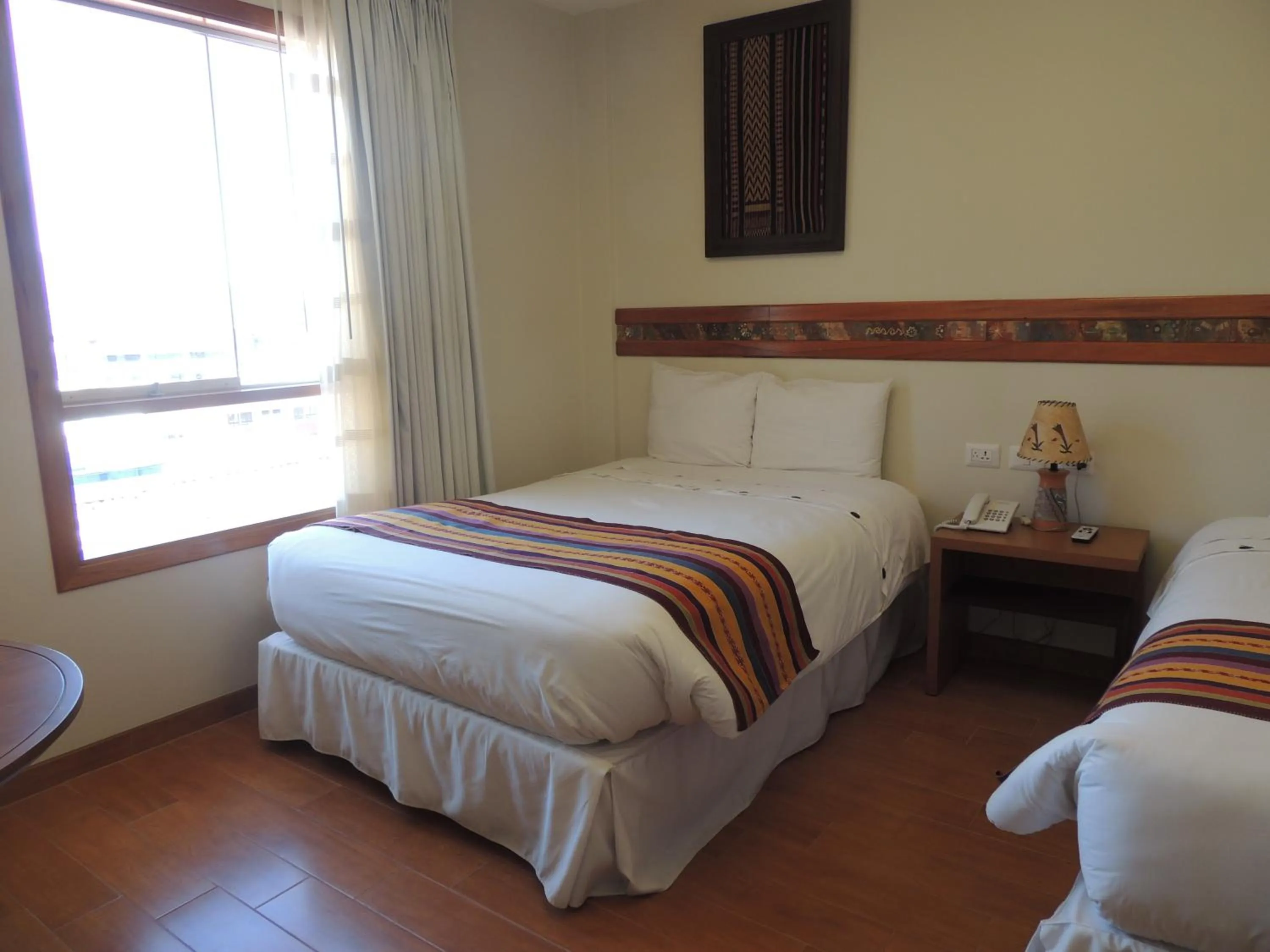 Photo of the whole room, Bed in Taypikala Hotel Cusco