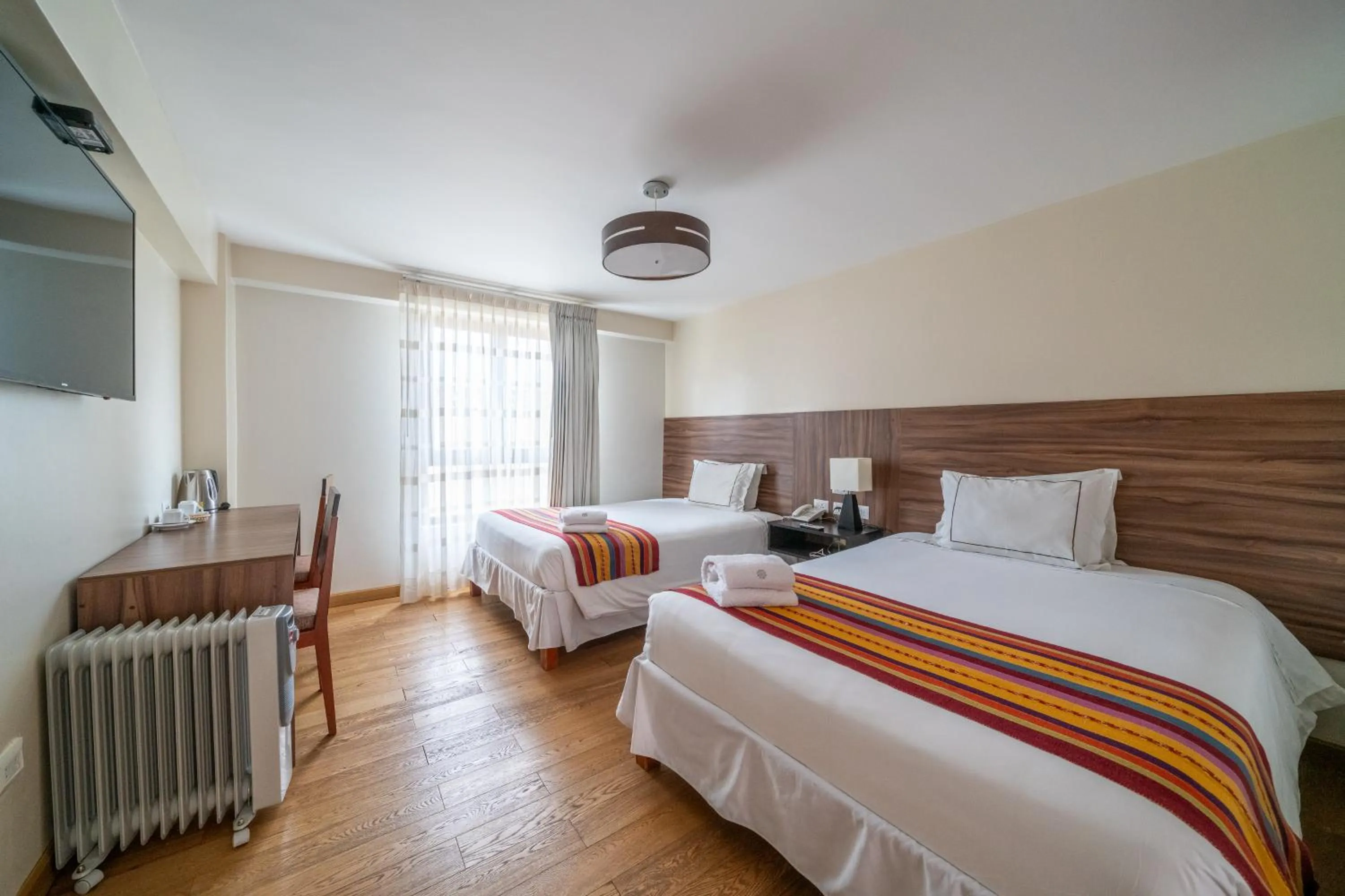 Photo of the whole room, Bed in Taypikala Hotel Cusco