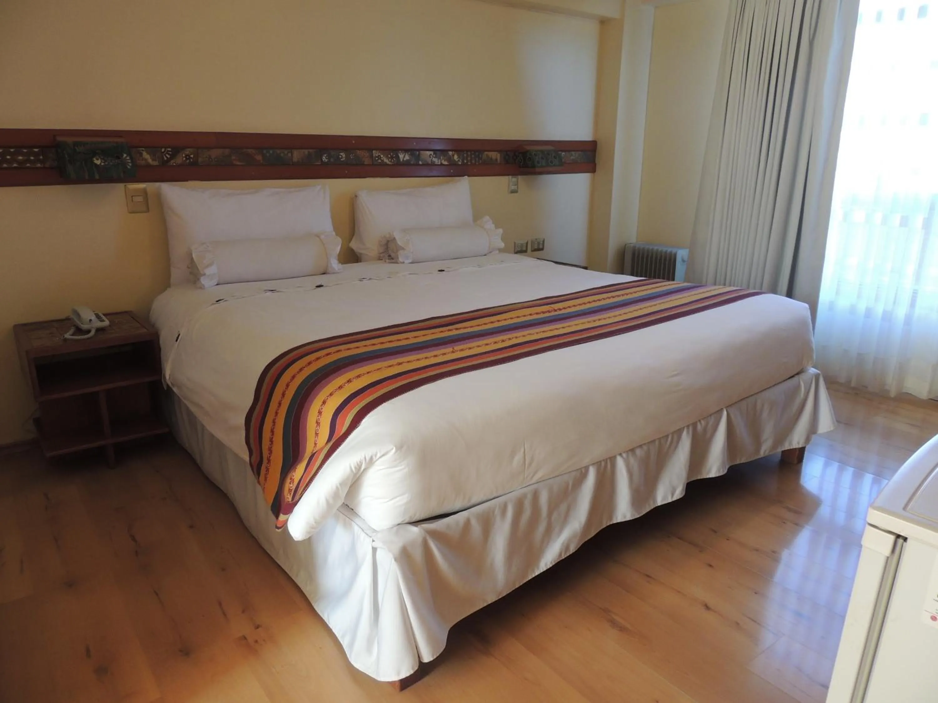 Bed in Taypikala Hotel Cusco