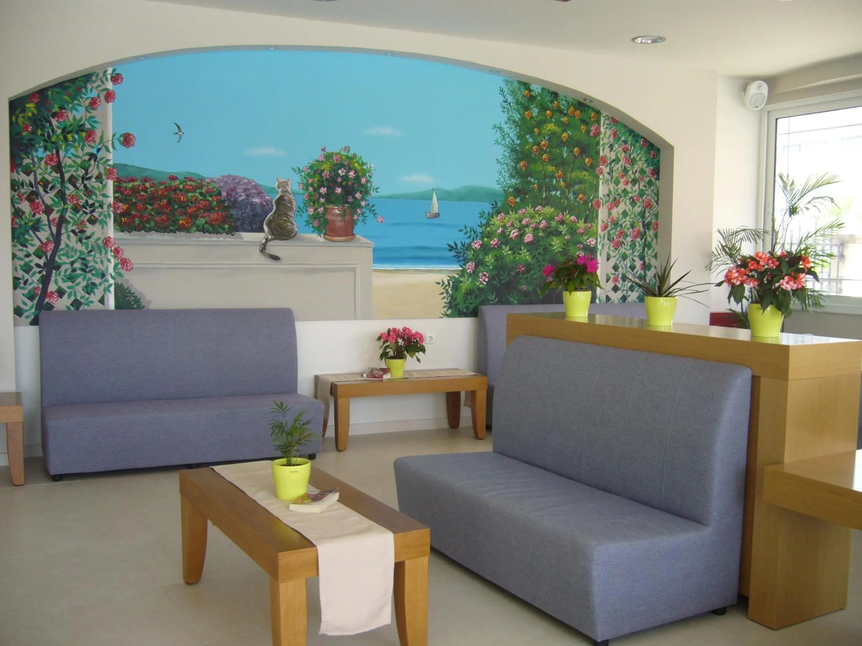 Communal lounge/ TV room in Rhodian Rose Hotel