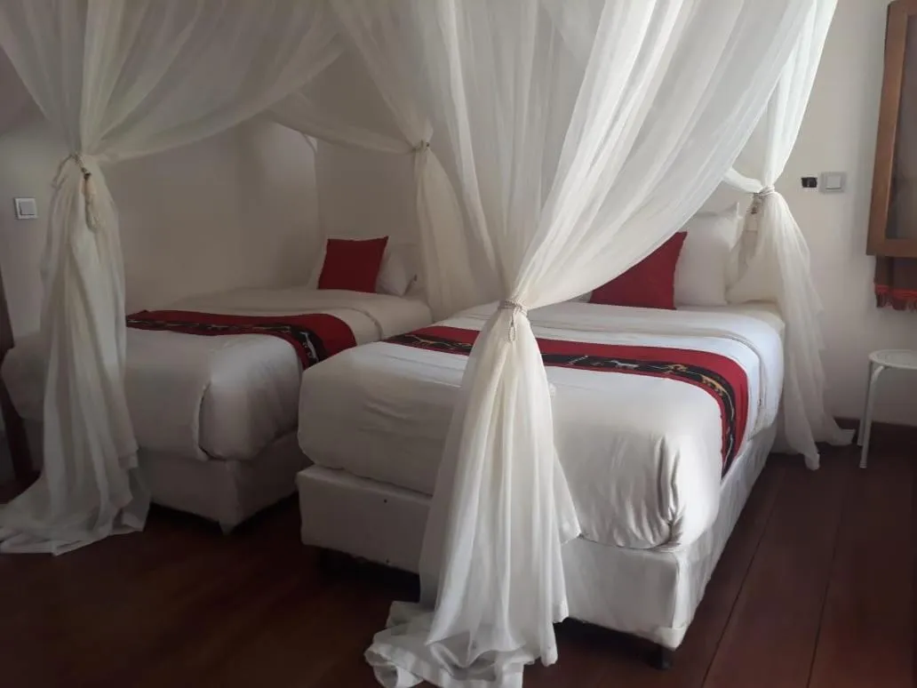 Bed in Rua Beach Resort Sumba