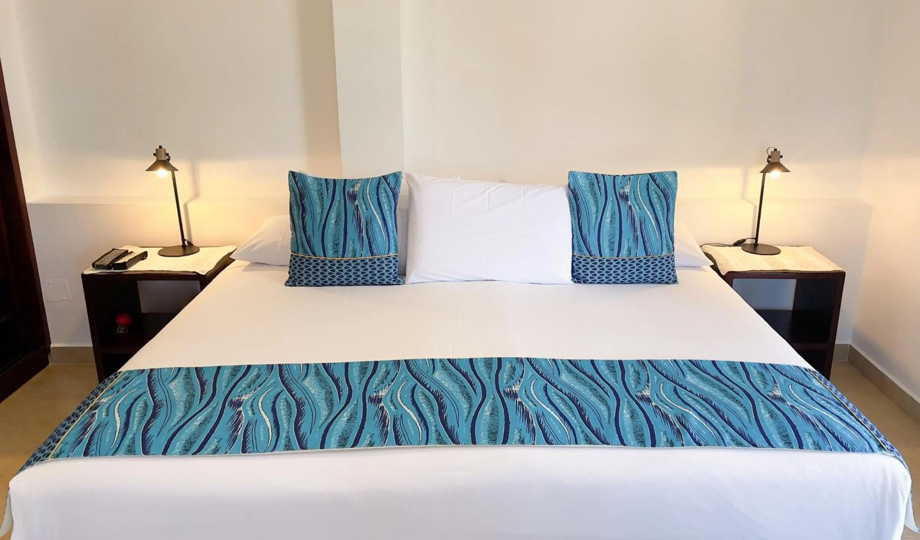 Bed in Hotel Galapagos Suites B&B