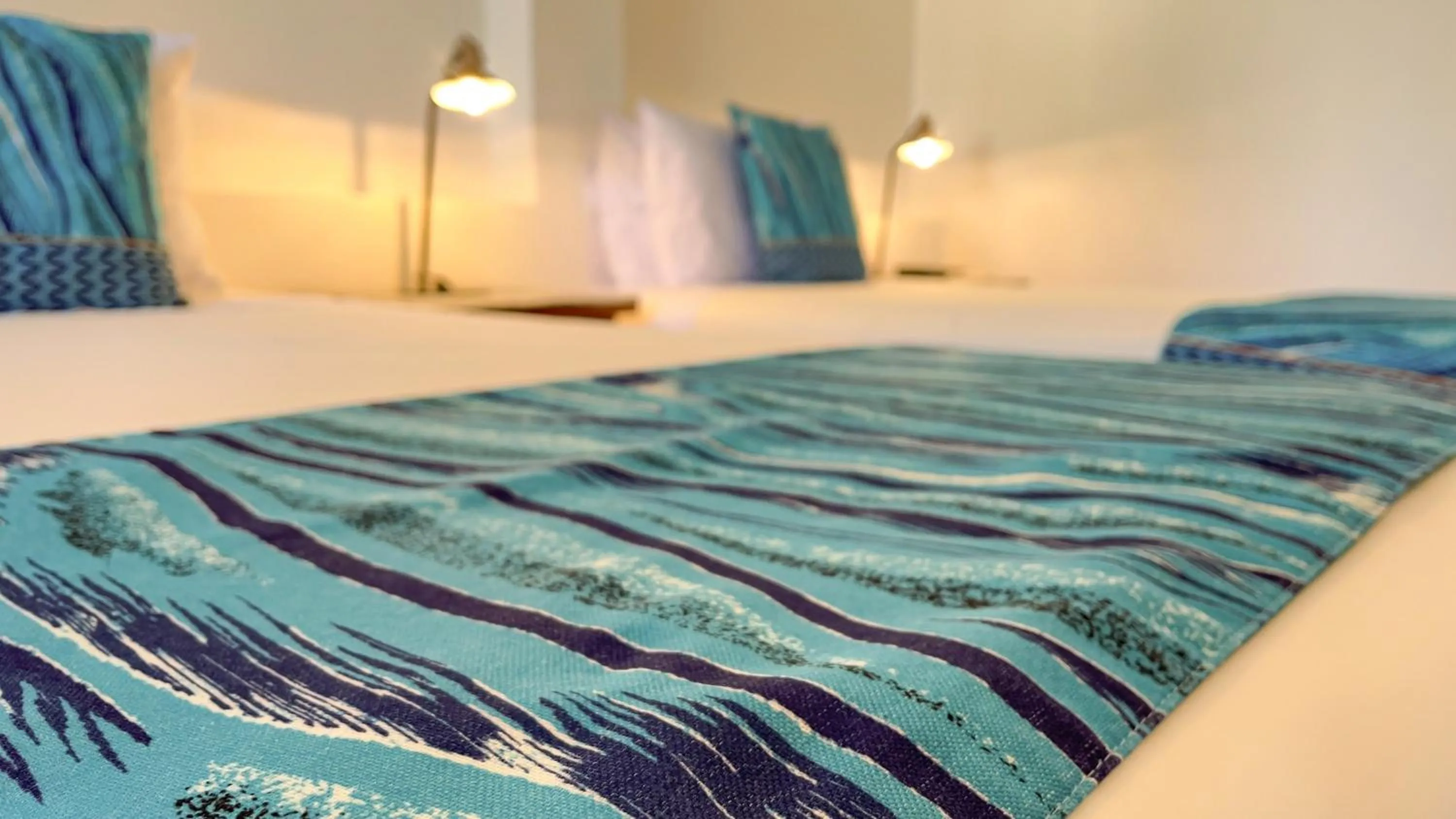 Bed in Hotel Galapagos Suites B&B