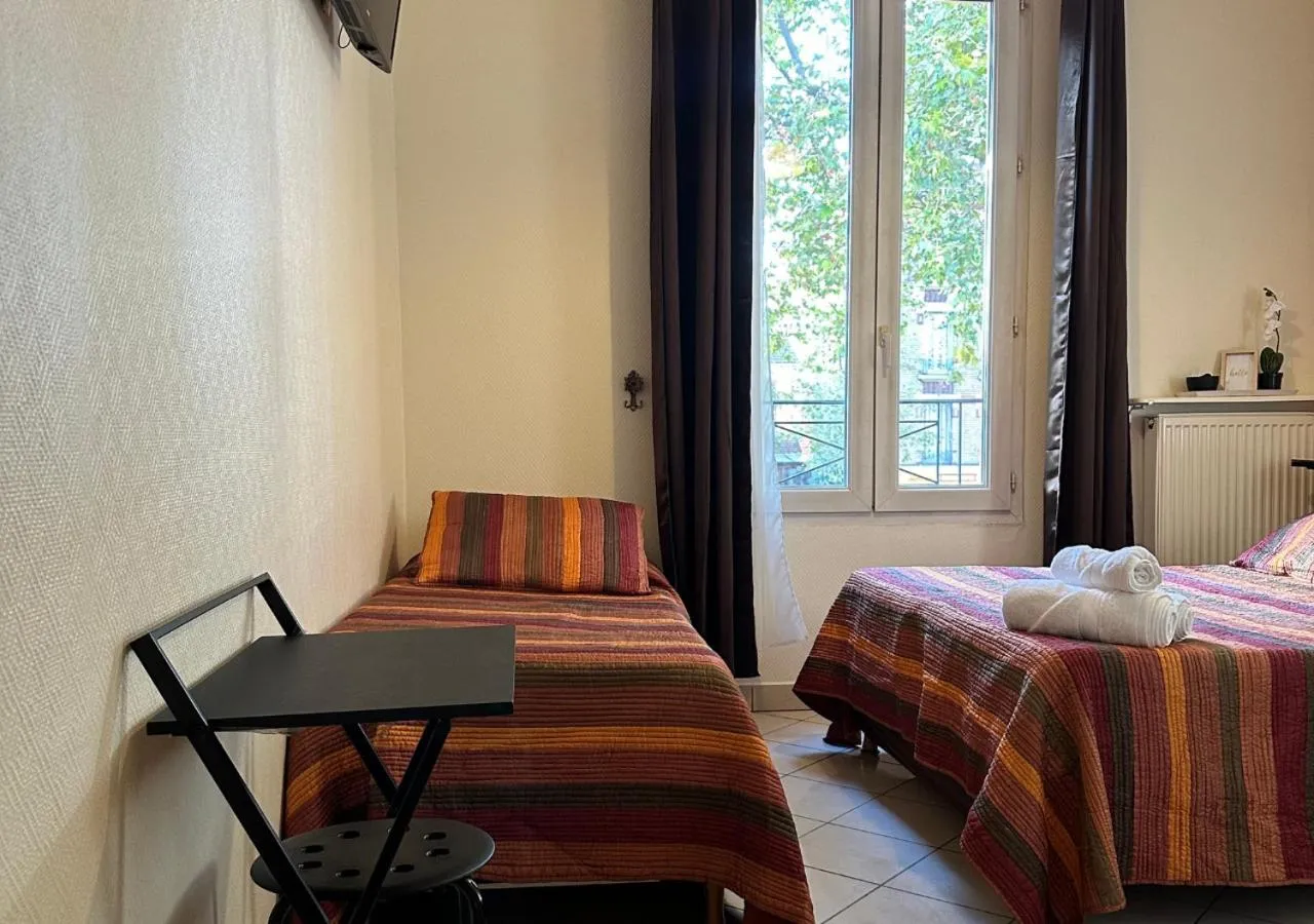 Bed in Hôtel Victor Hugo