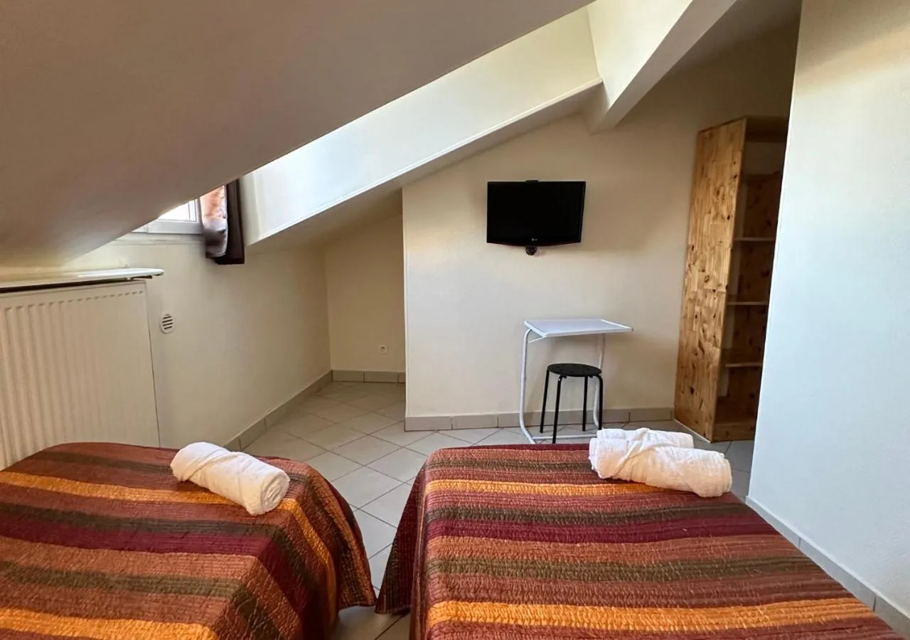 Bed in Hôtel Victor Hugo