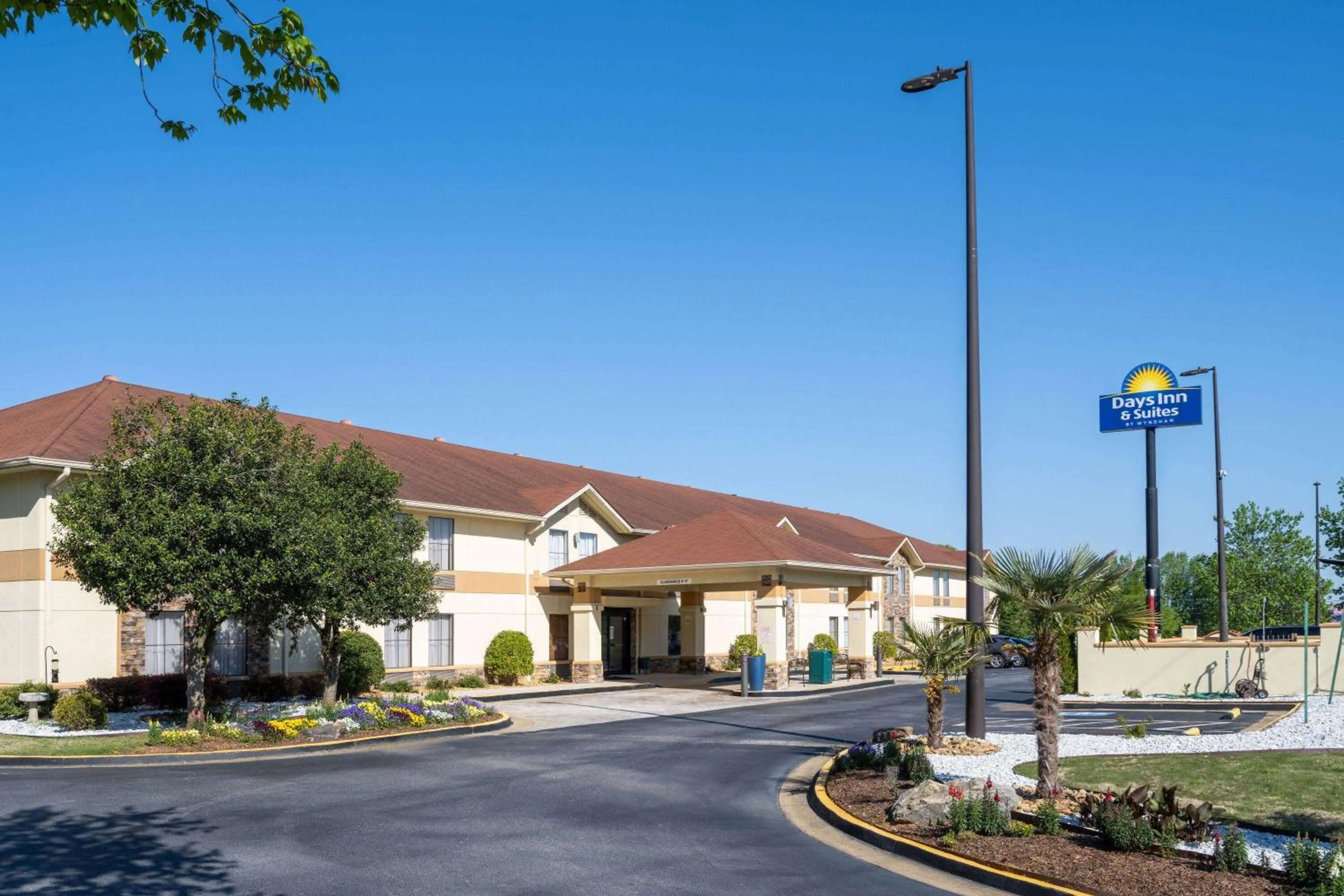 Property building in Days Inn & Suites by Wyndham Commerce