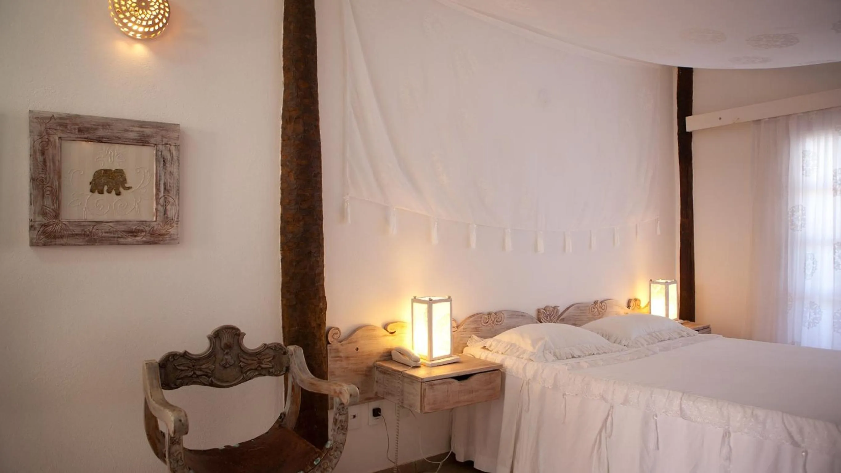 Bed in Bruno Marambaia Charme Hotel