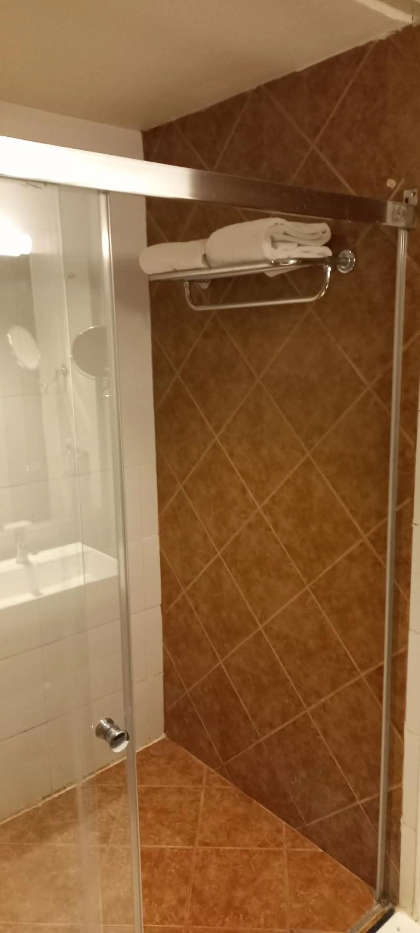 Shower in Royal Orchid Central, Shimoga