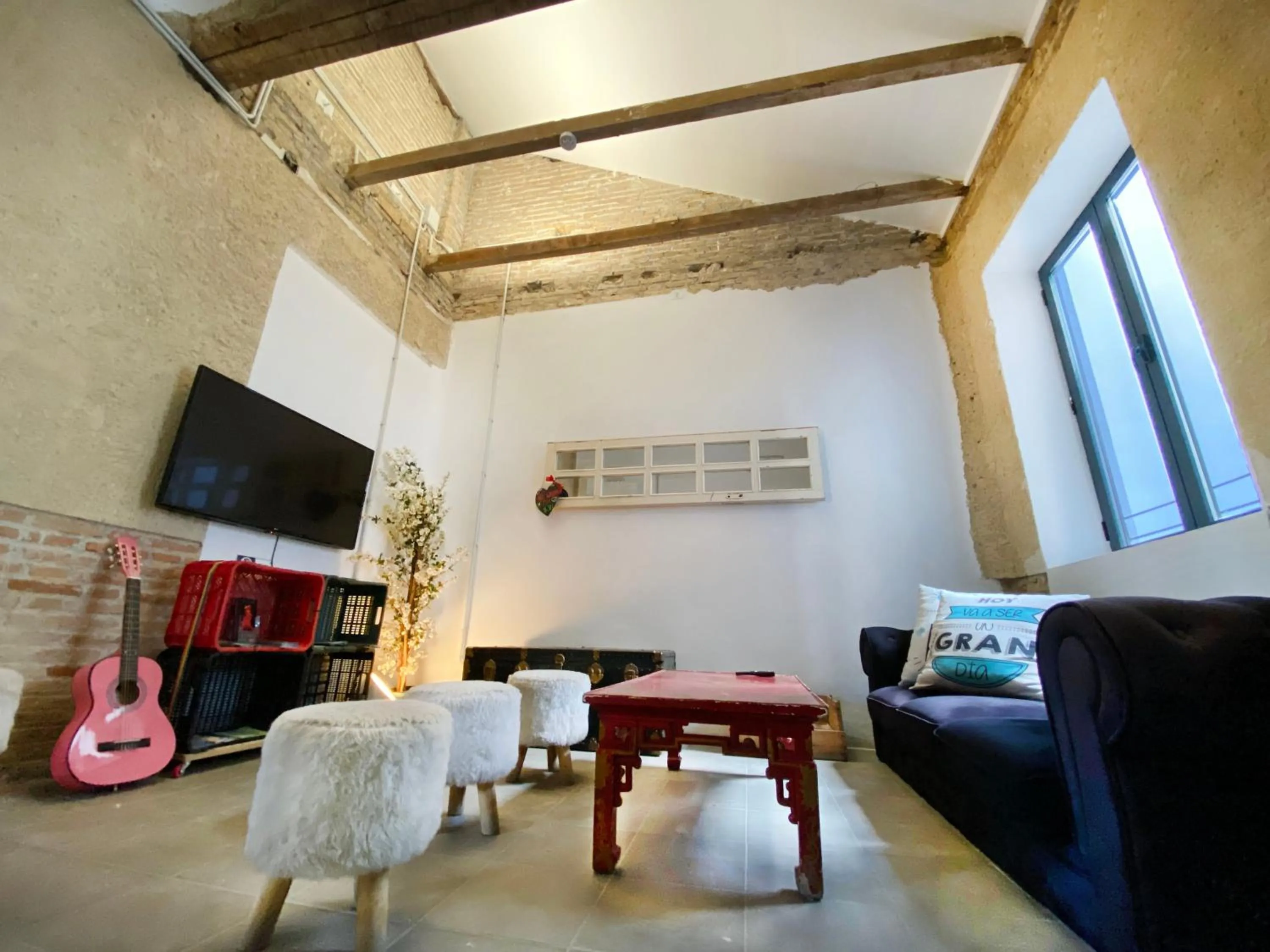 Communal lounge/ TV room in ECO Hostel