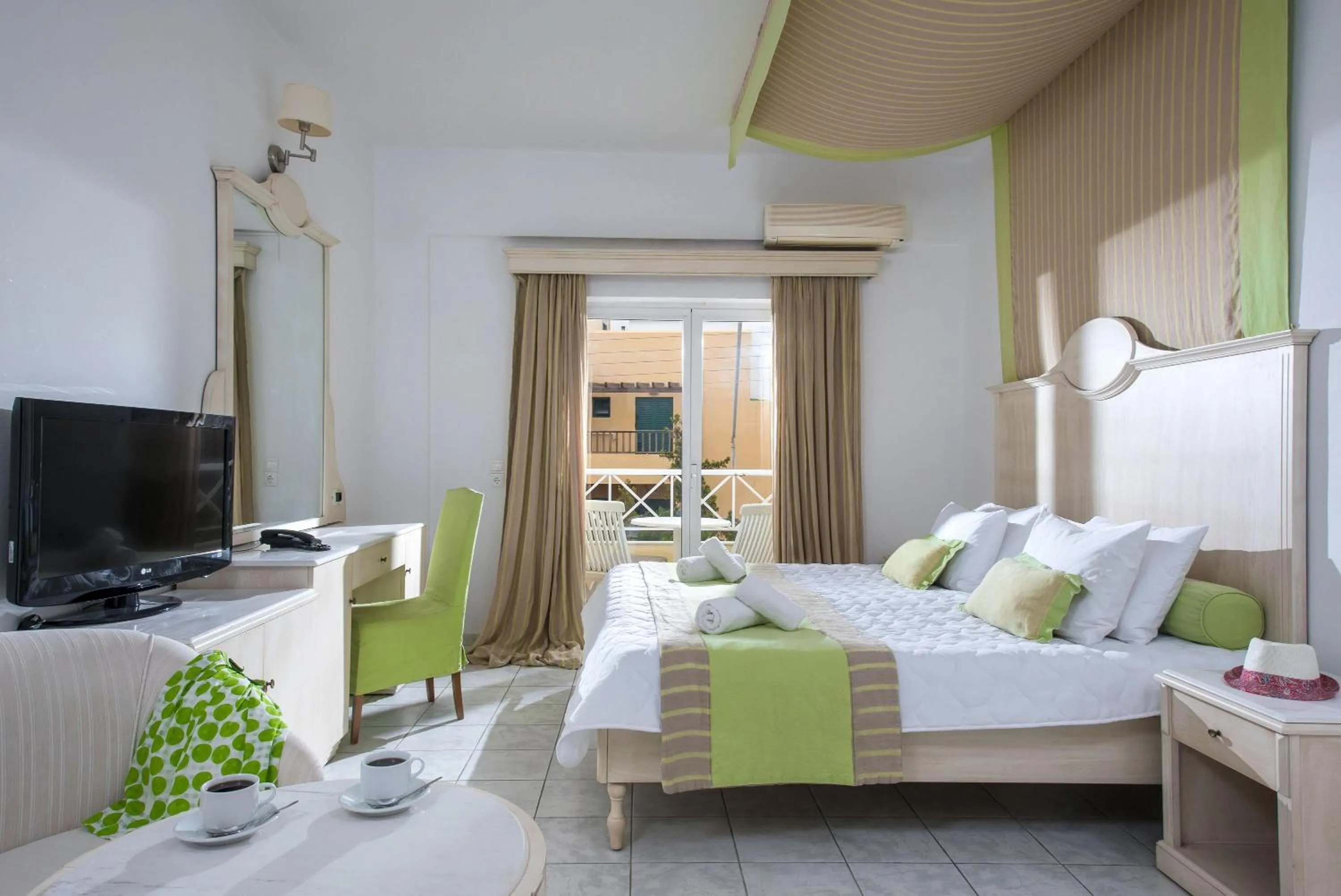 Bed in Elmi Beach Hotel & Suites