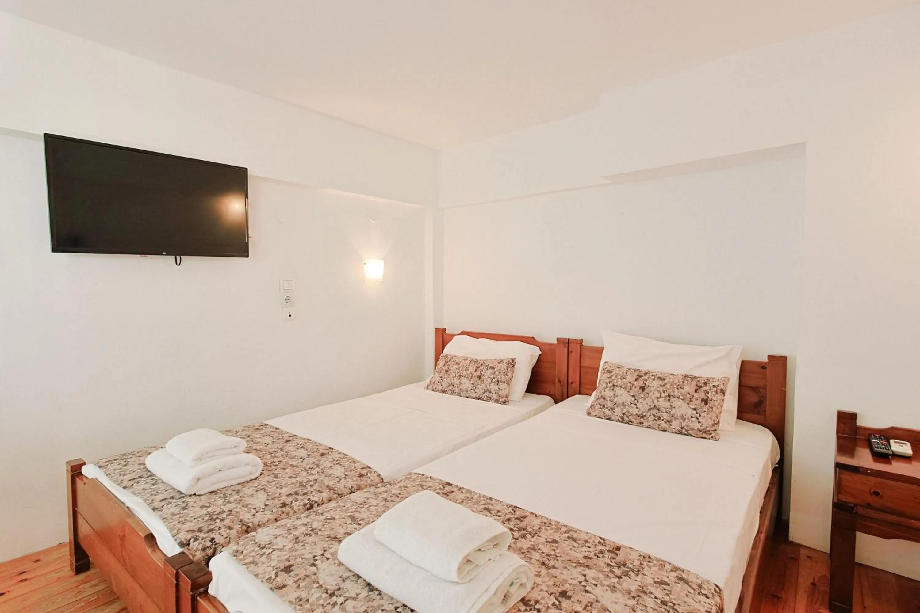 Bed in Elmi Beach Hotel & Suites