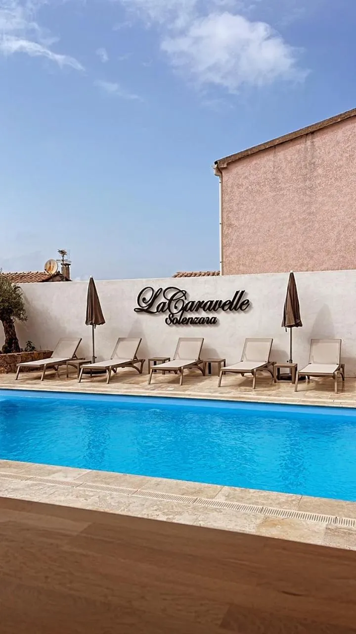 Swimming pool in Hôtel Restaurant La Caravelle
