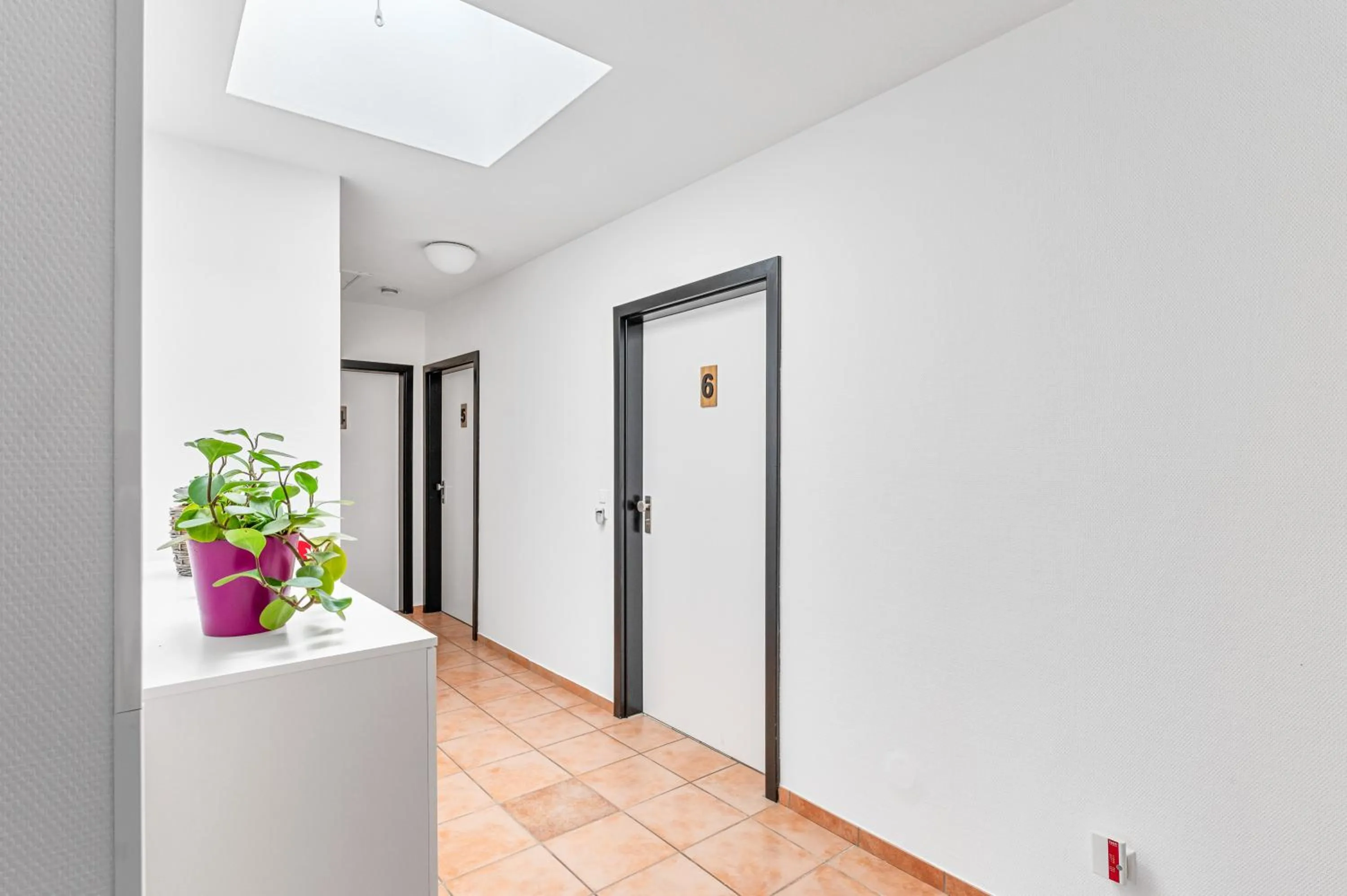 Property logo or sign in Atelier Guesthouse