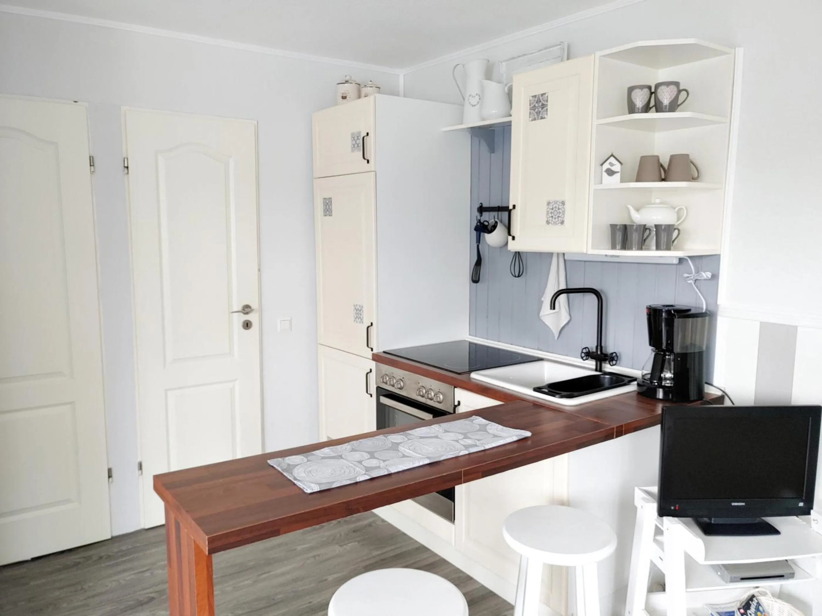 Kitchen or kitchenette in Ferienwohnung *Fenja*