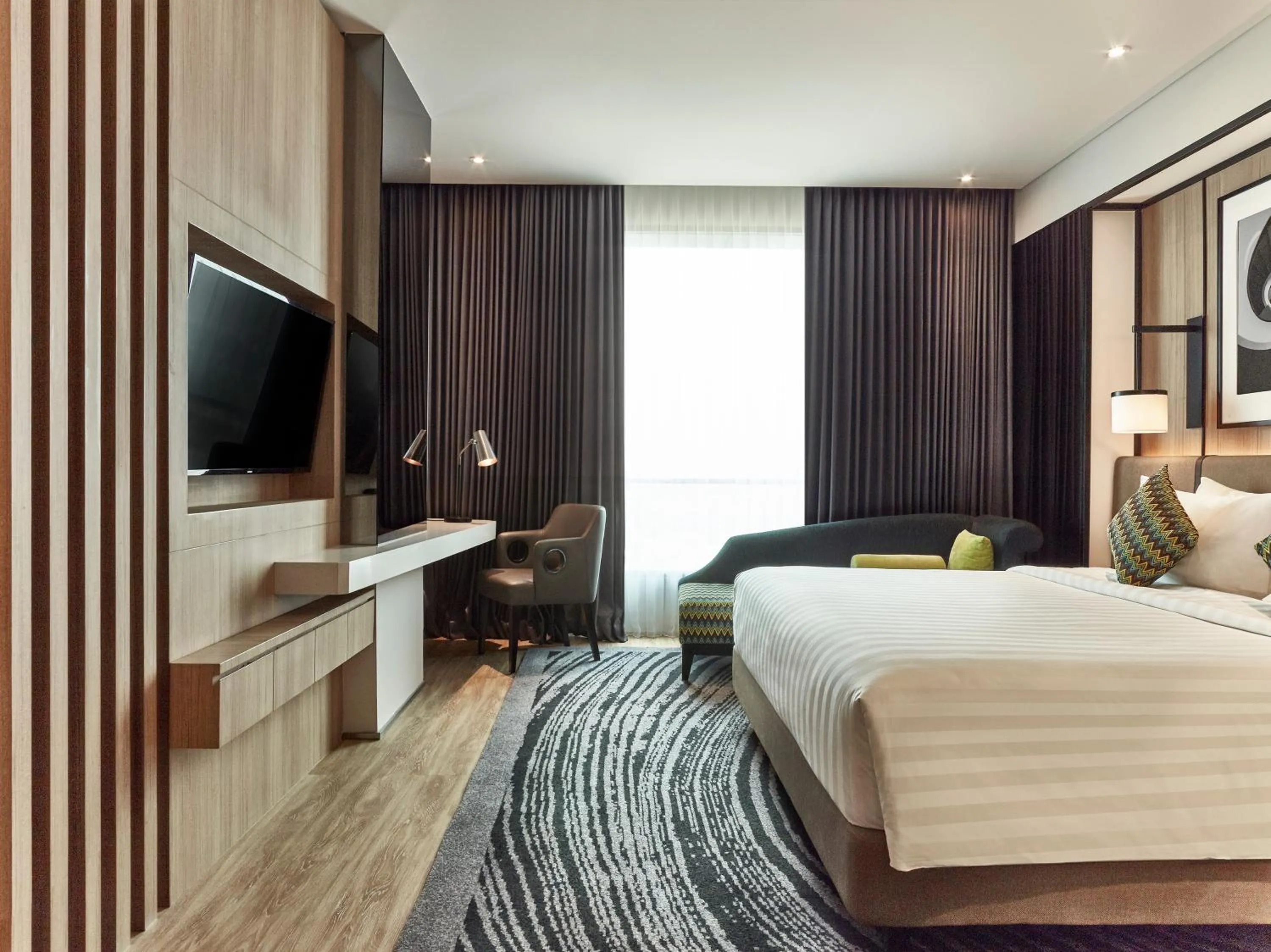 Communal lounge/ TV room, Bed in Novotel Karawang