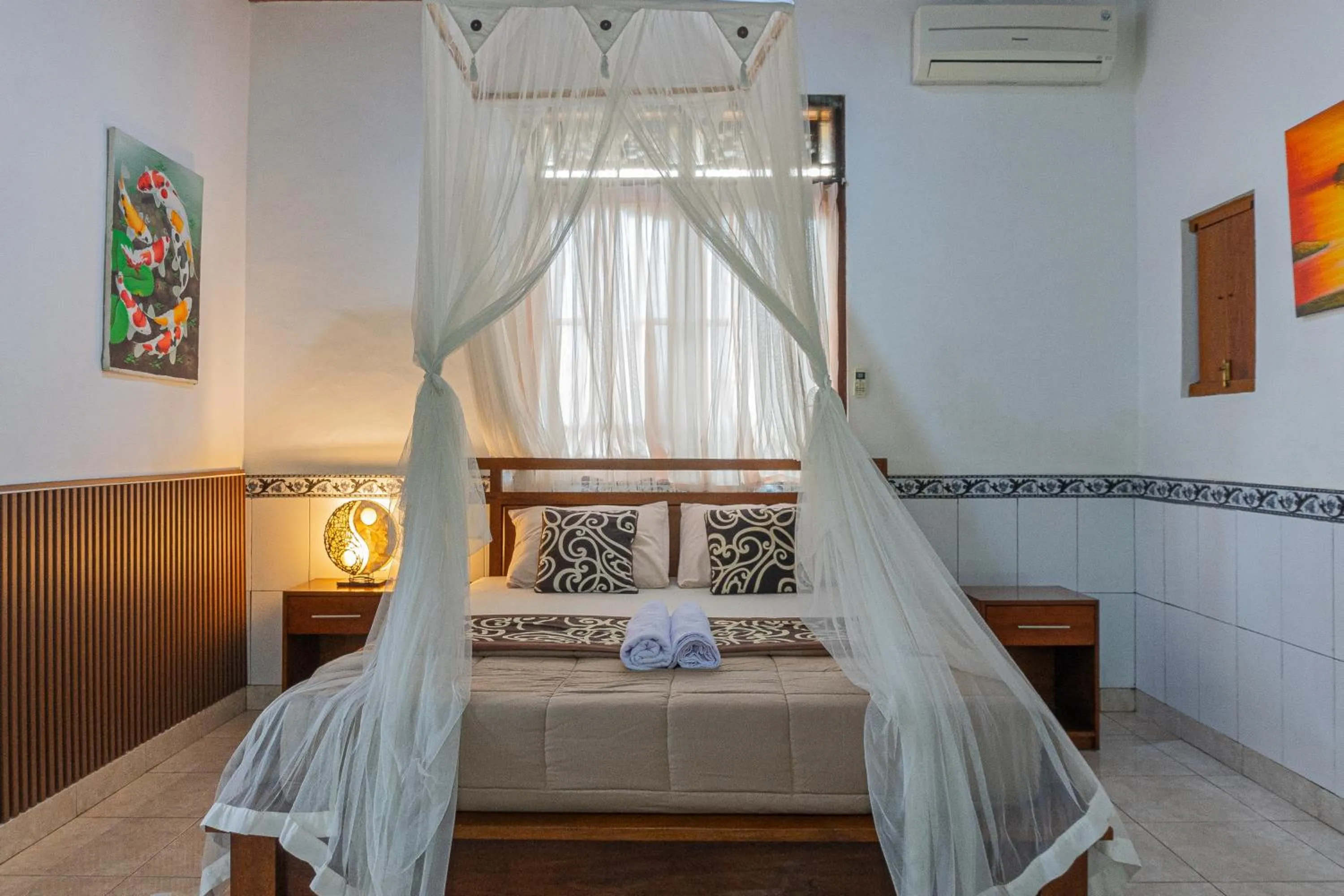 Bed in Artha Dewata Home Stay