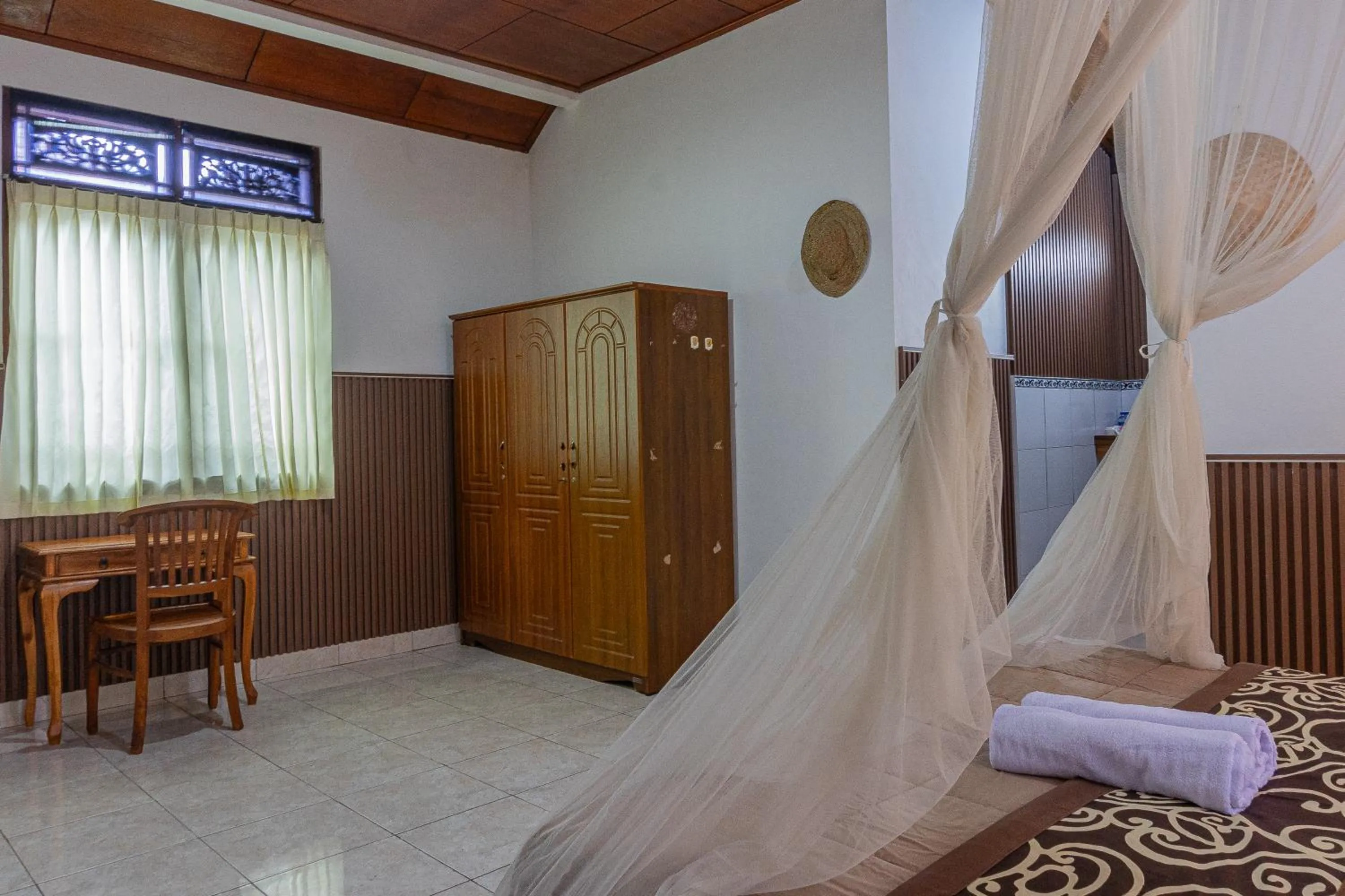 Bed in Artha Dewata Home Stay