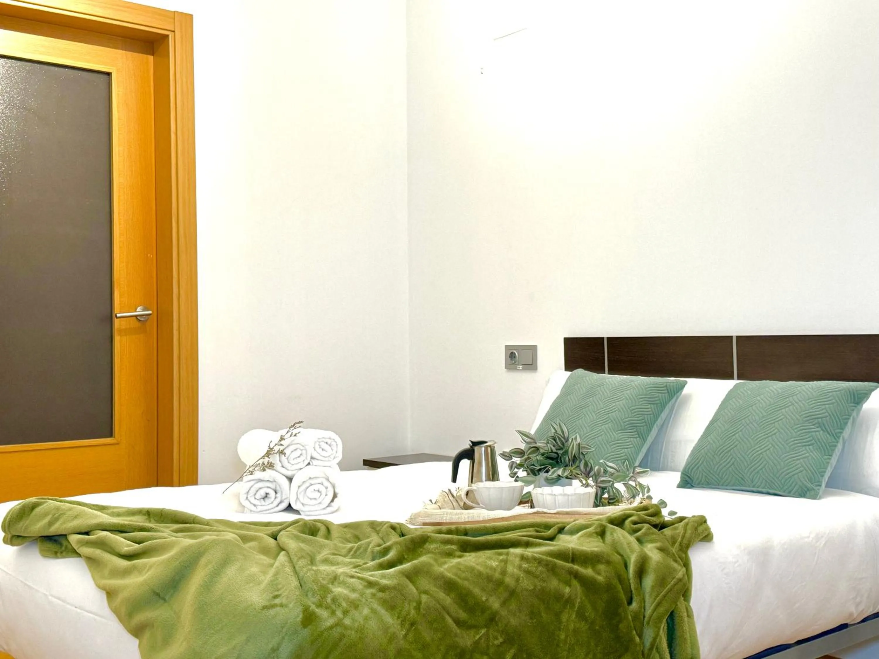 Bed in Wave Apartments