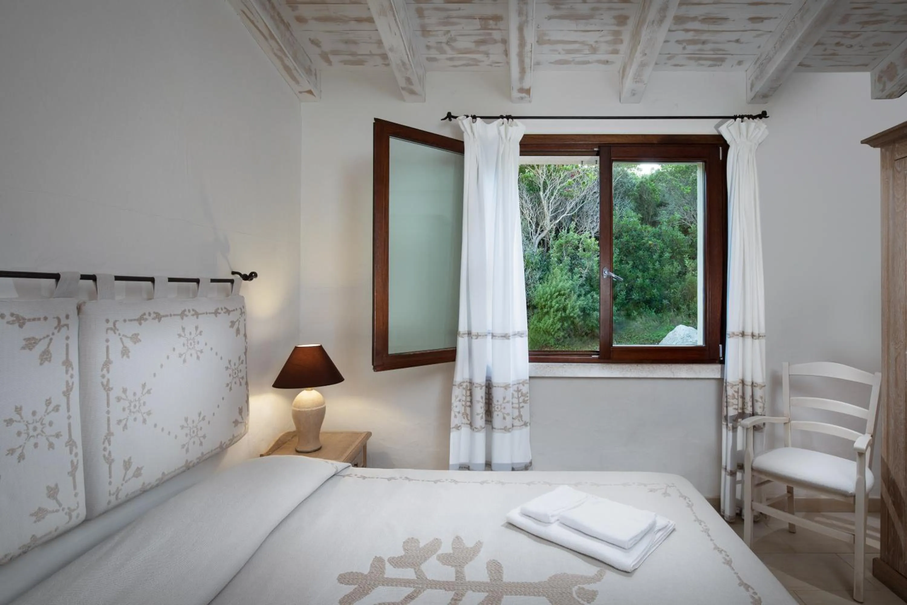 Photo of the whole room, Bed in Punta Falcone Resort