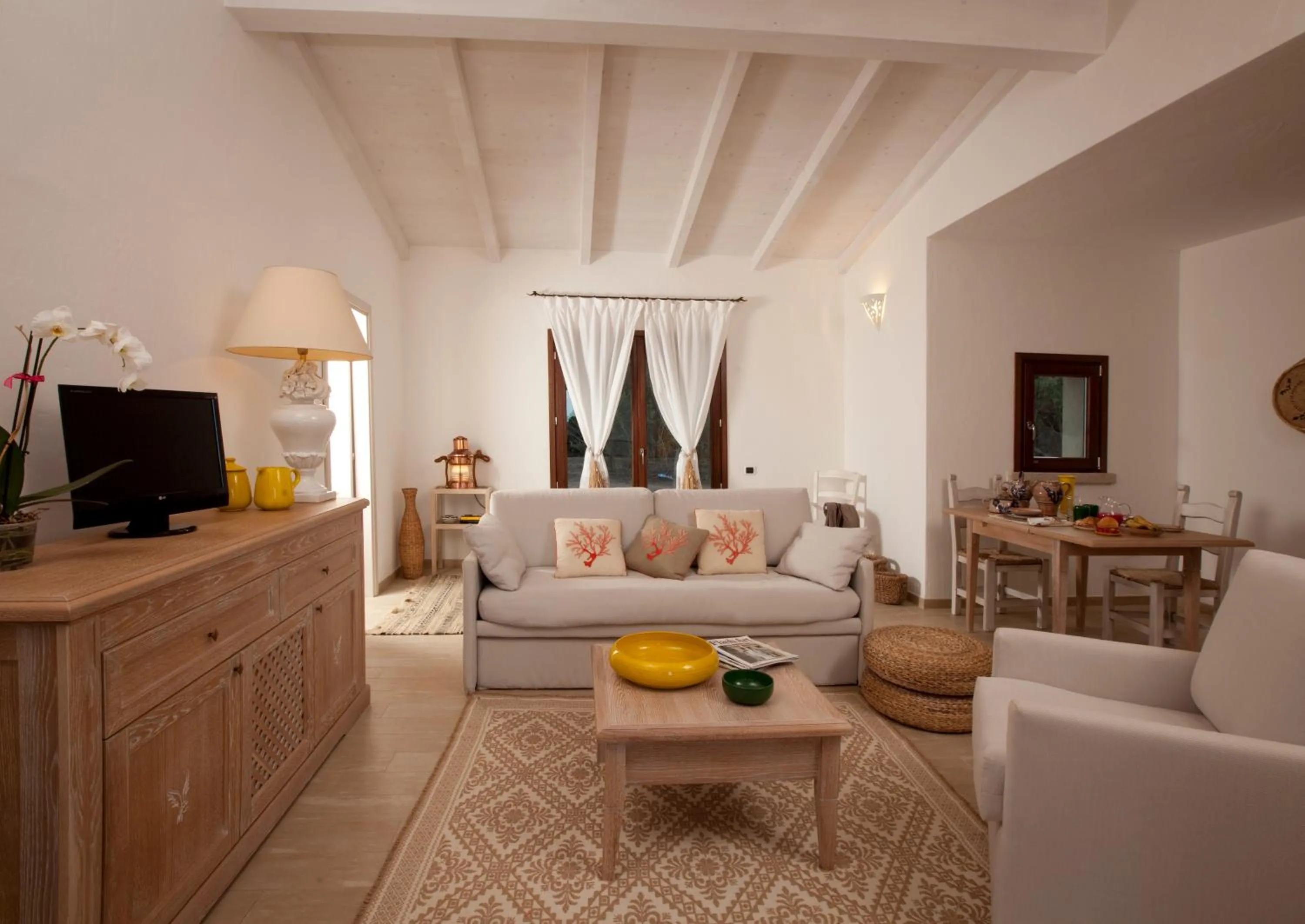 Communal lounge/ TV room in Punta Falcone Resort