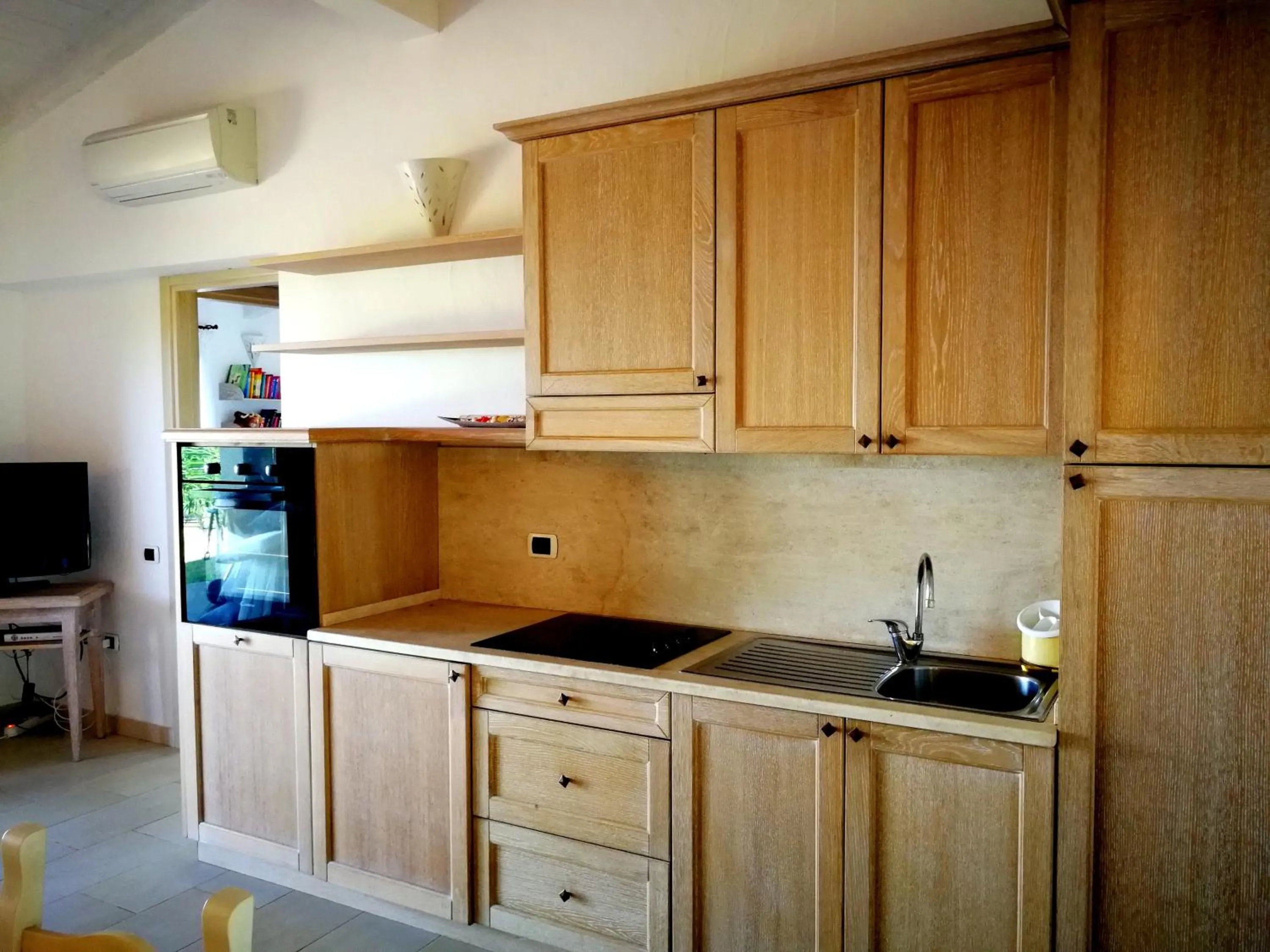 Kitchen or kitchenette in Punta Falcone Resort