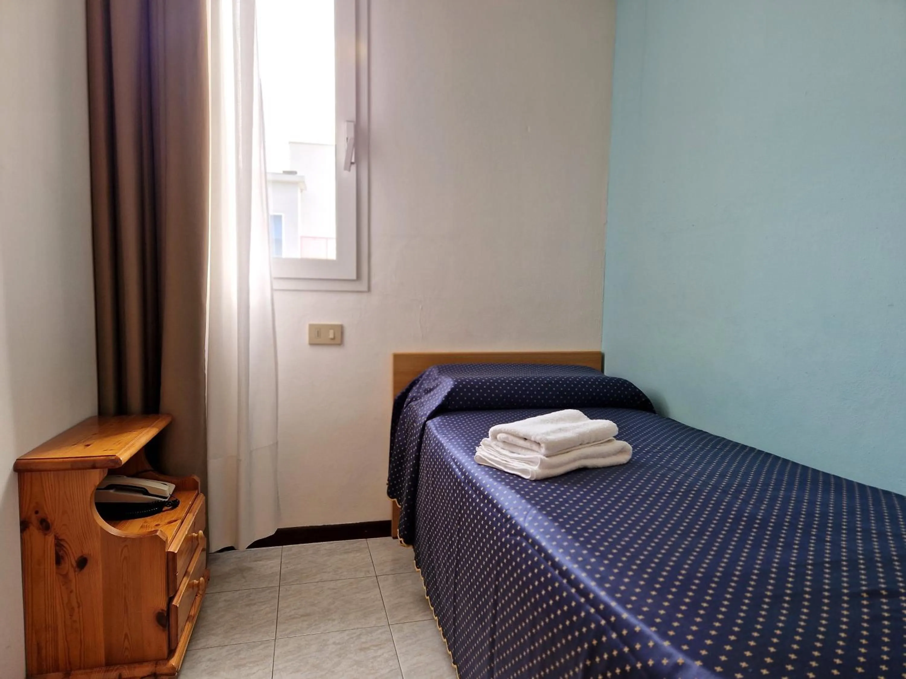 Bed in Hotel Danubio