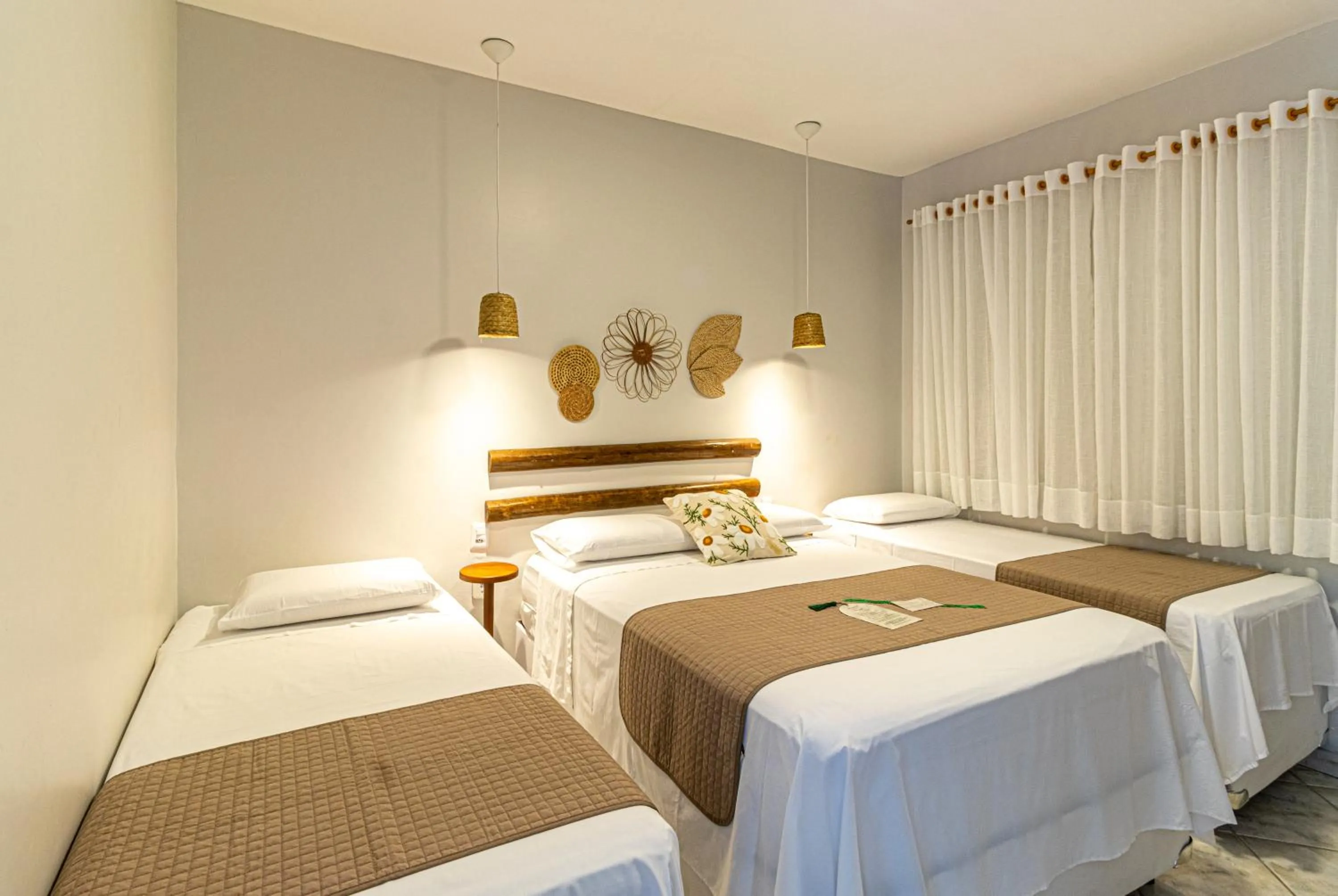 Bed in Pousada Encantos de Arraial