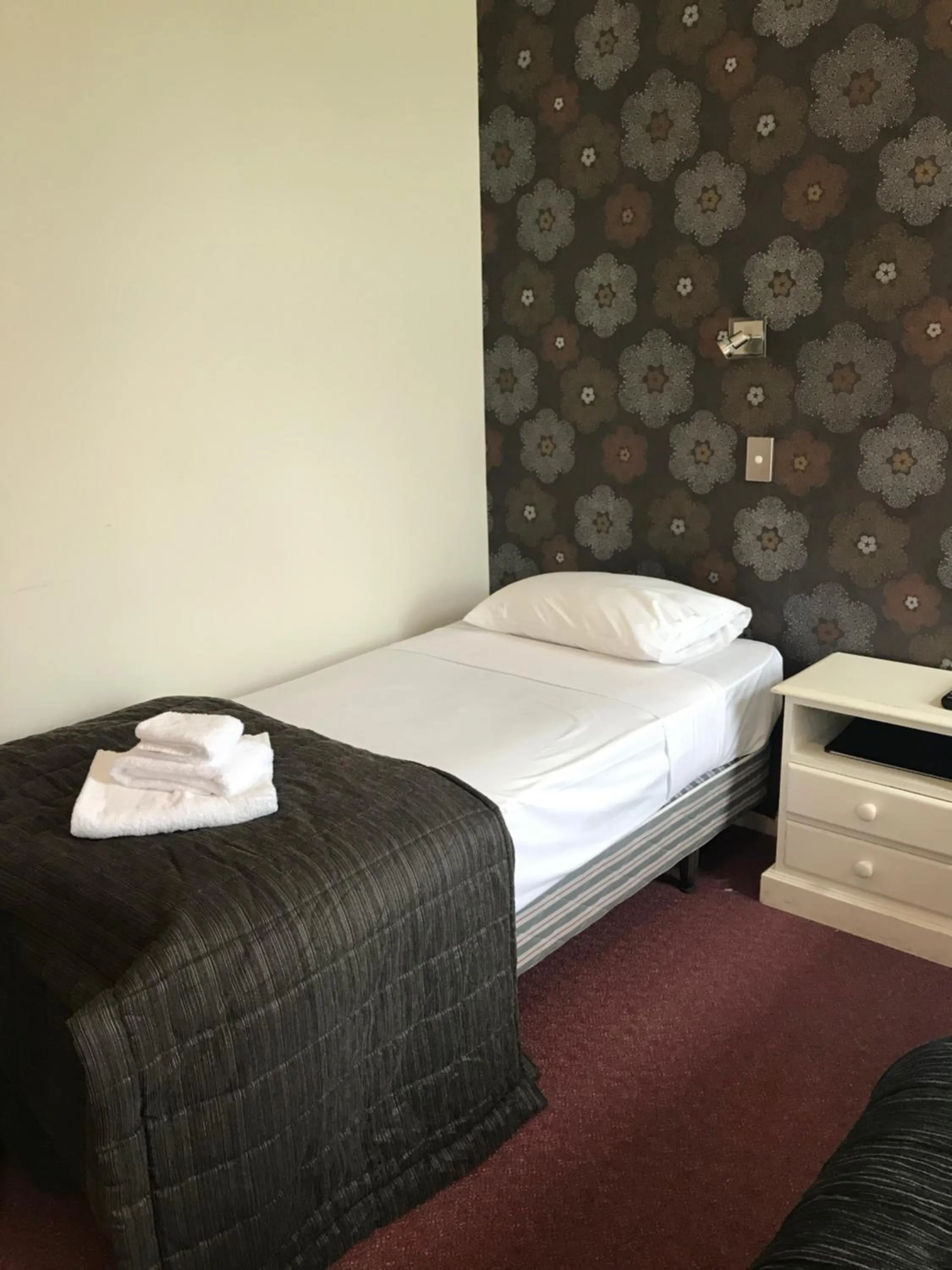 Bed in Criterion Club Hotel