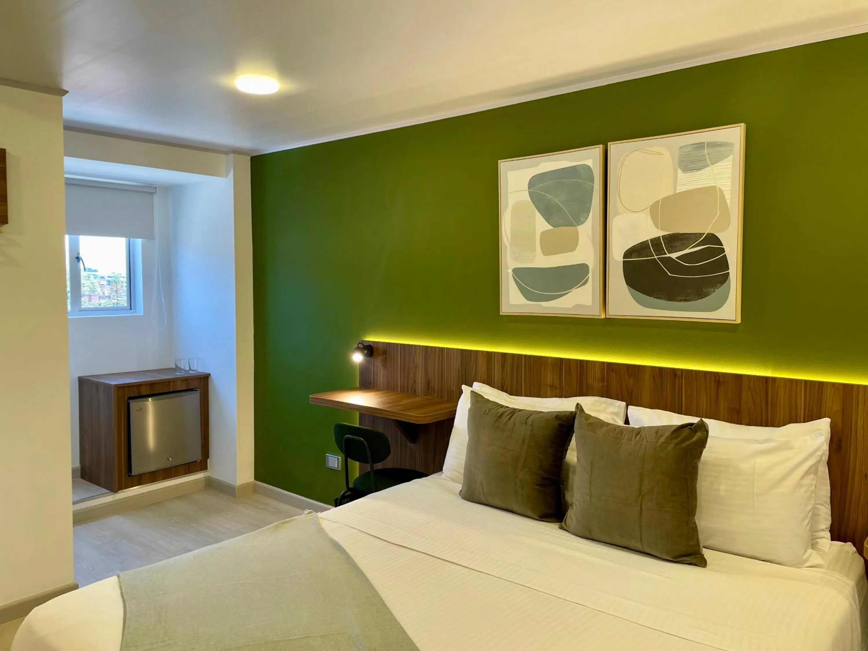 Bed in 122 Plaza Apartahotel