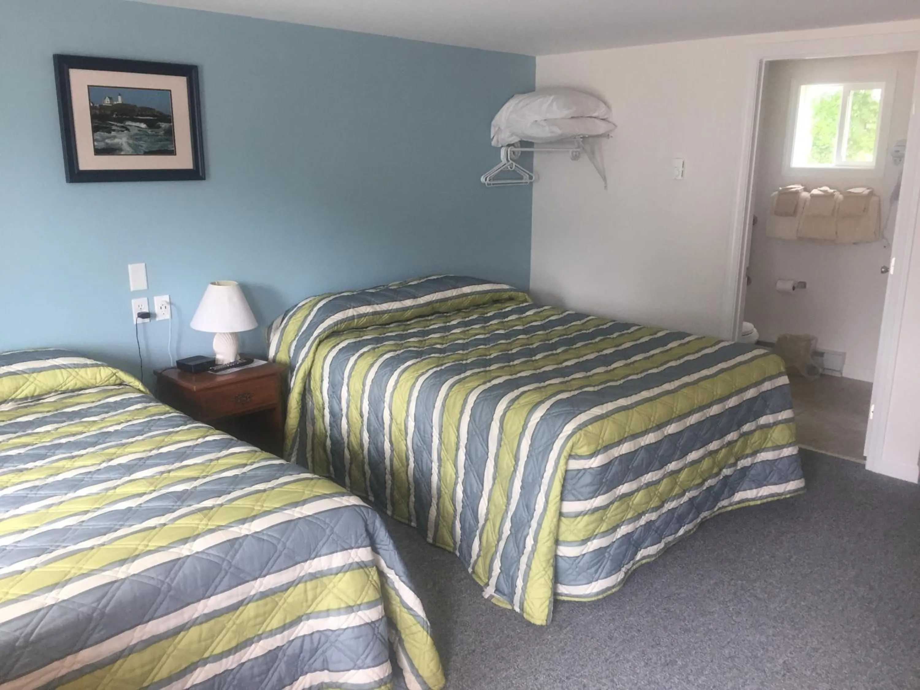 Bed in Ne'r Beach Motel