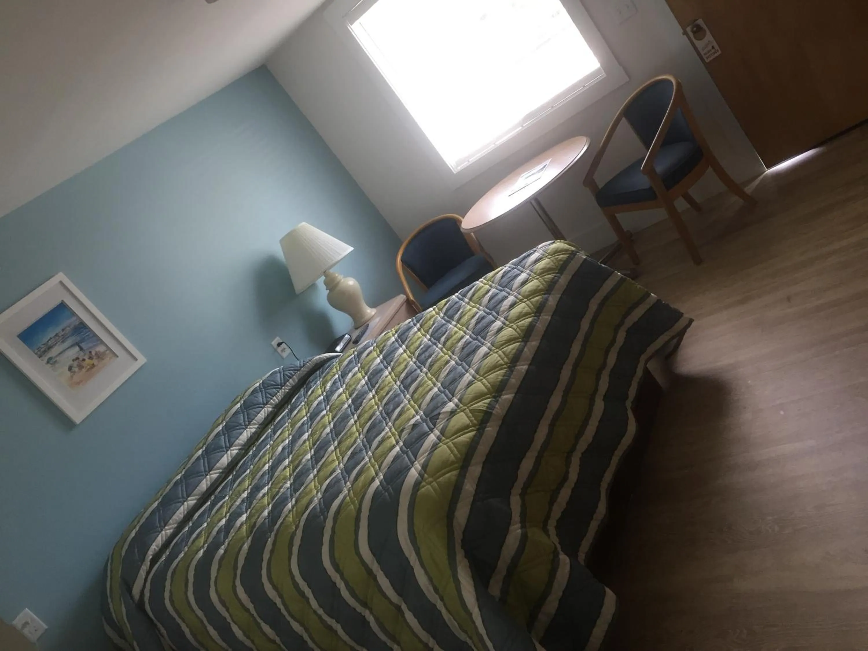 Bed in Ne'r Beach Motel