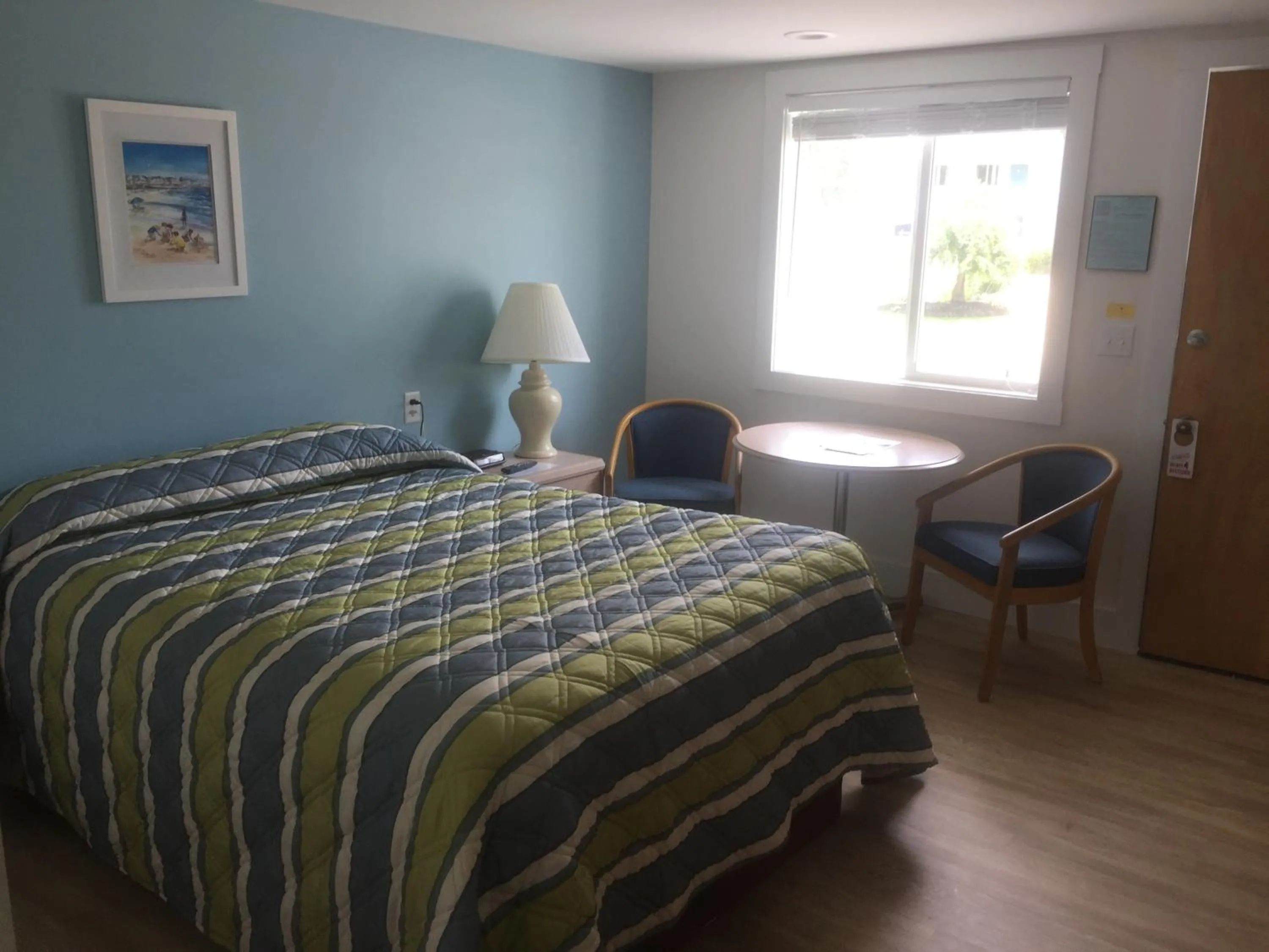 Bed in Ne'r Beach Motel