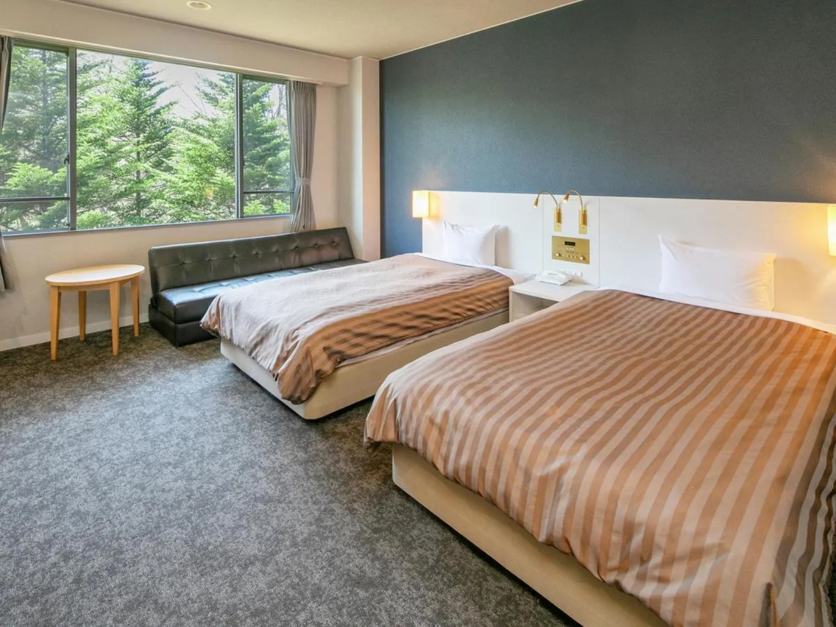 Bed in Itoen Hotel Kusatsu