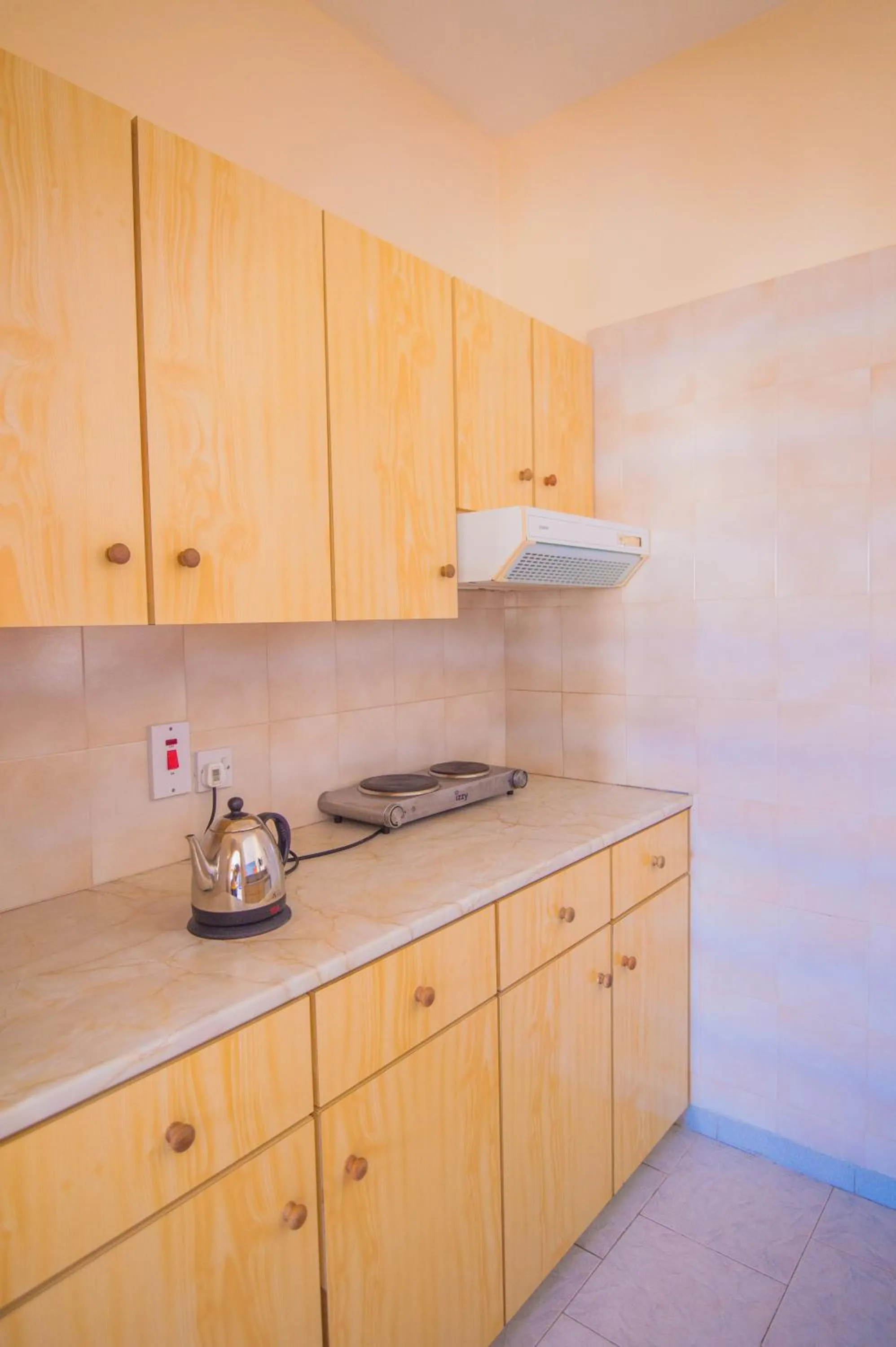 Kitchen or kitchenette in Windmills Hotel Apartments
