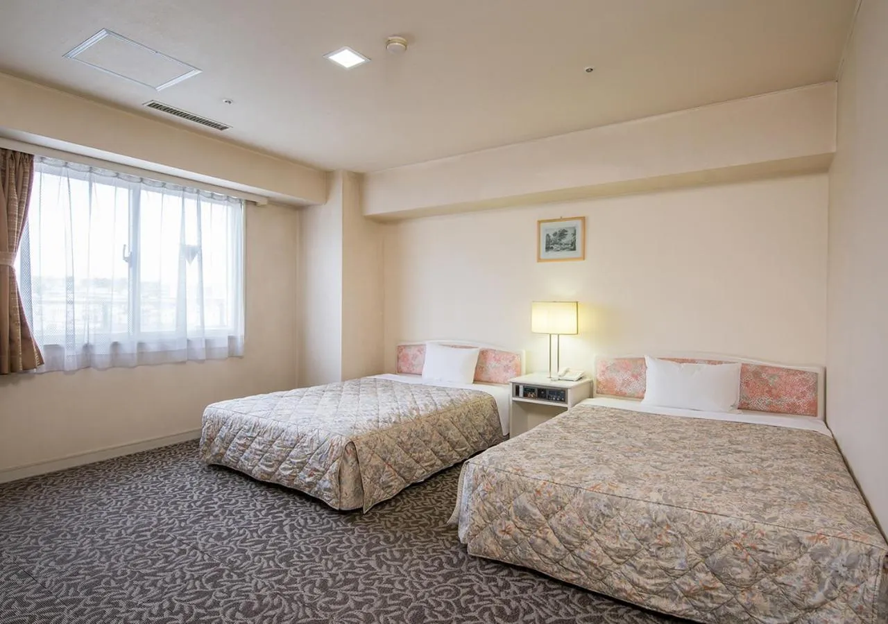 Bed in Komoro Grand Castle Hotel