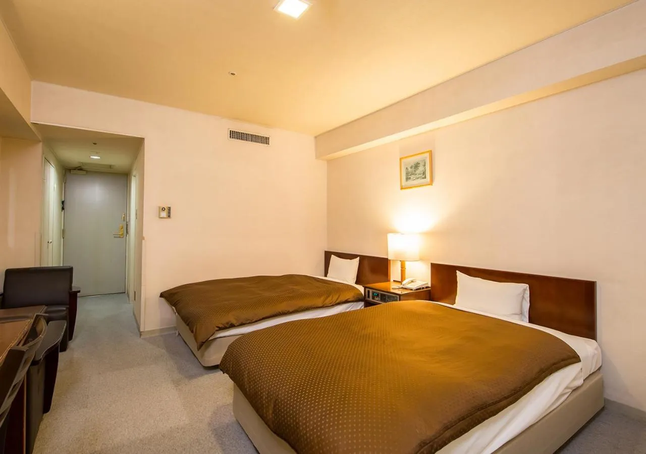 Bed in Komoro Grand Castle Hotel