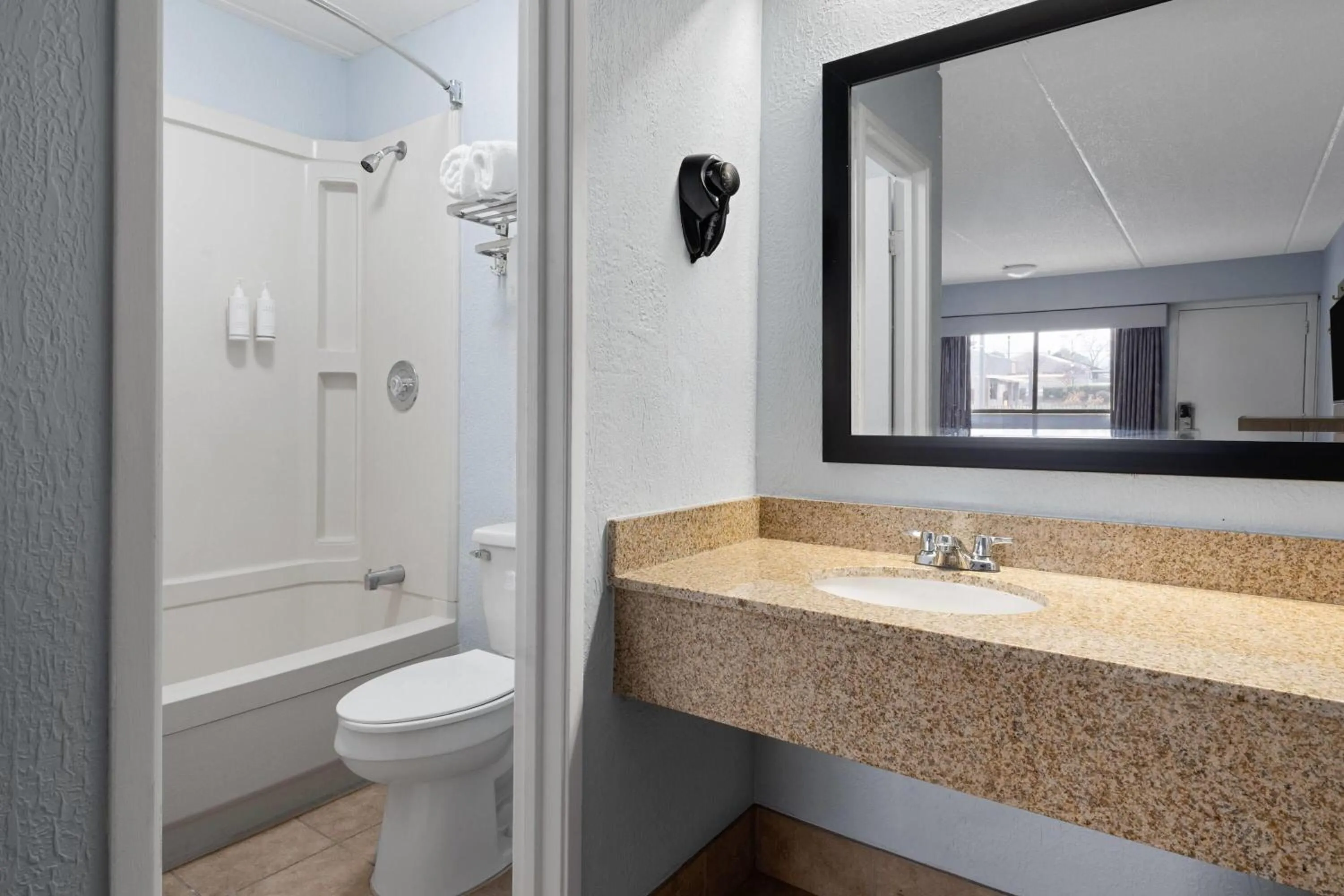 Bathroom in Days Inn by Wyndham Charlotte University