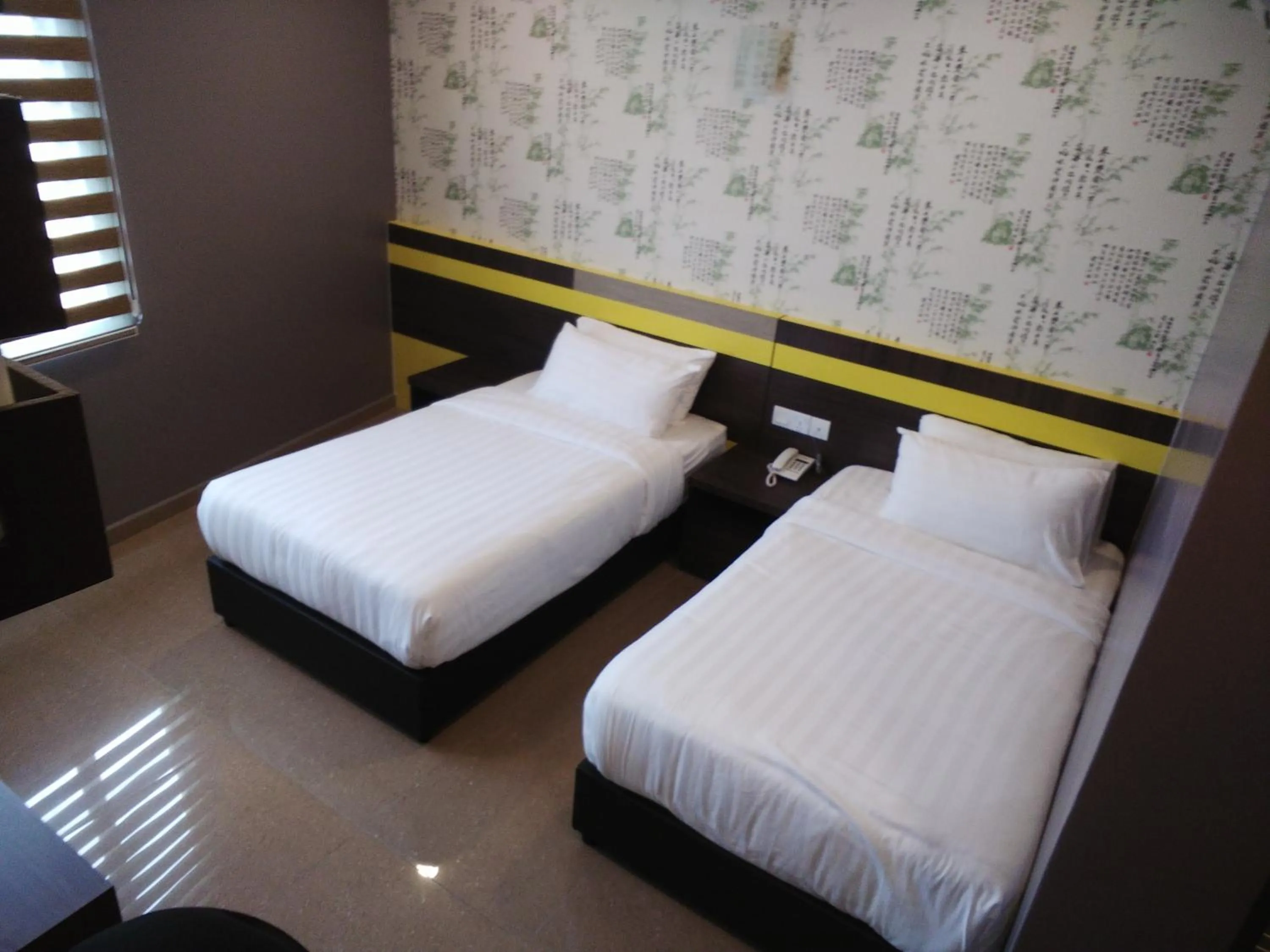 Bed in Kampar Boutique Hotel