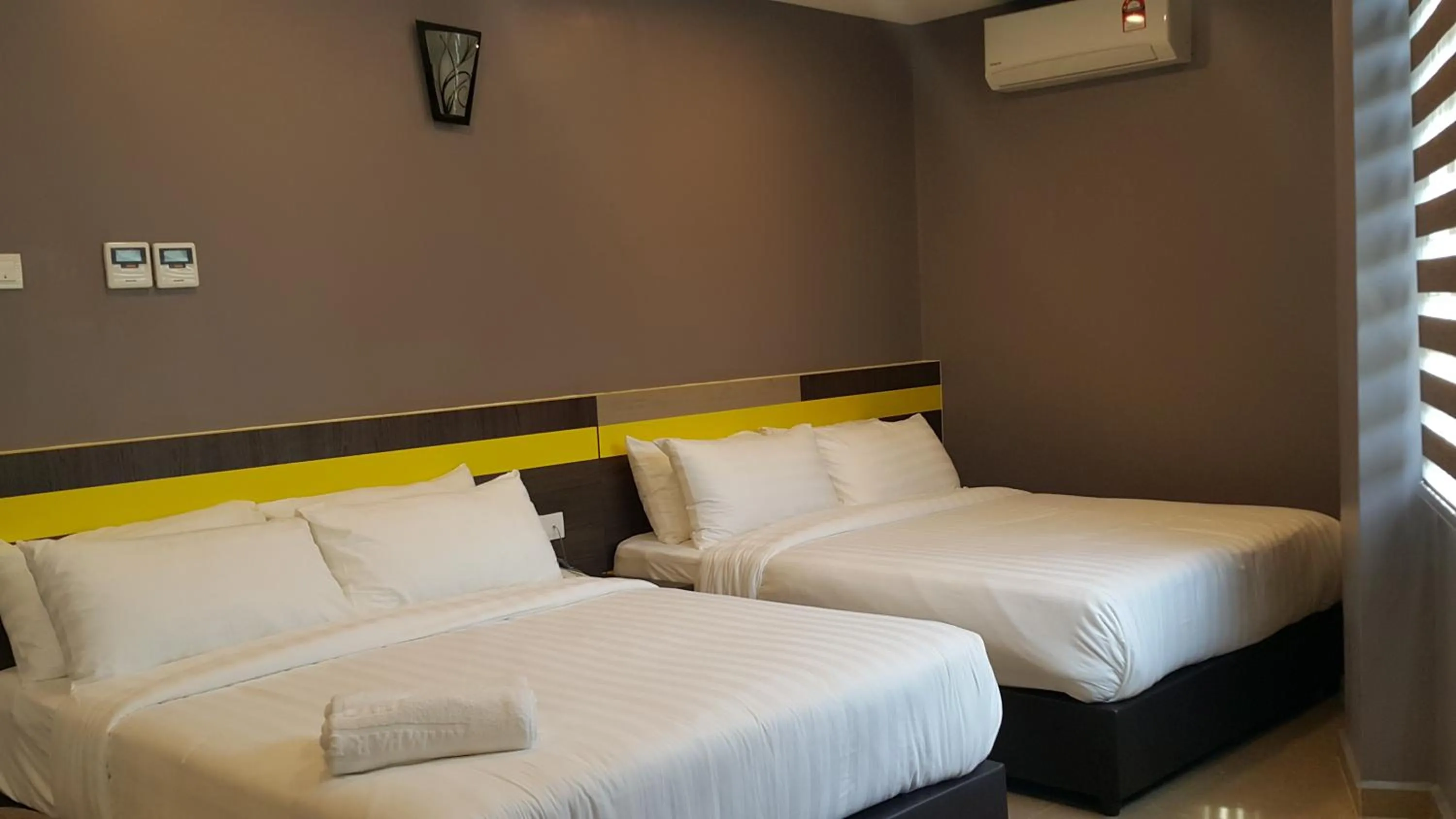 Bed in Kampar Boutique Hotel