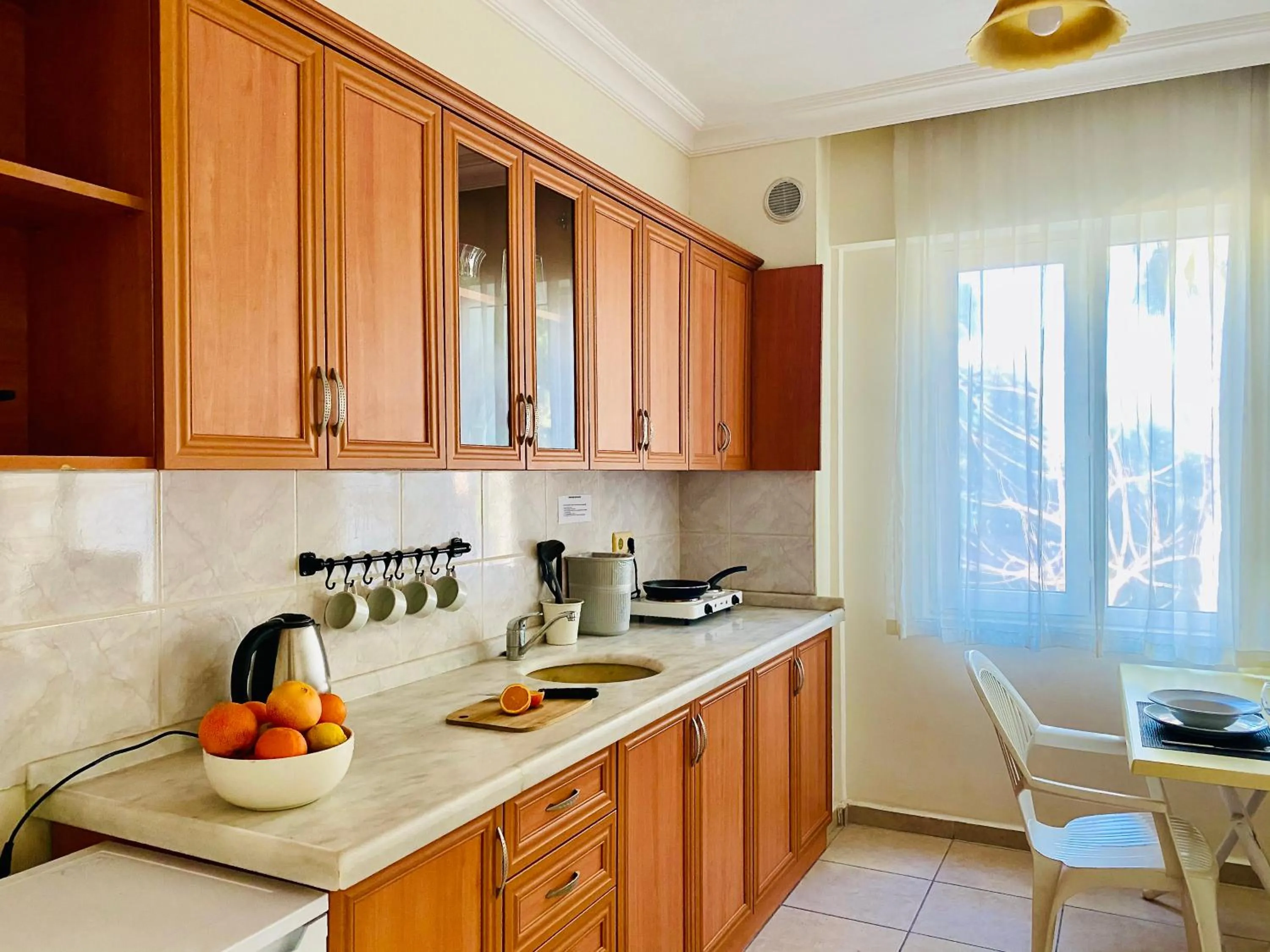 Kitchen or kitchenette in Melissa Garden Apart Hotel